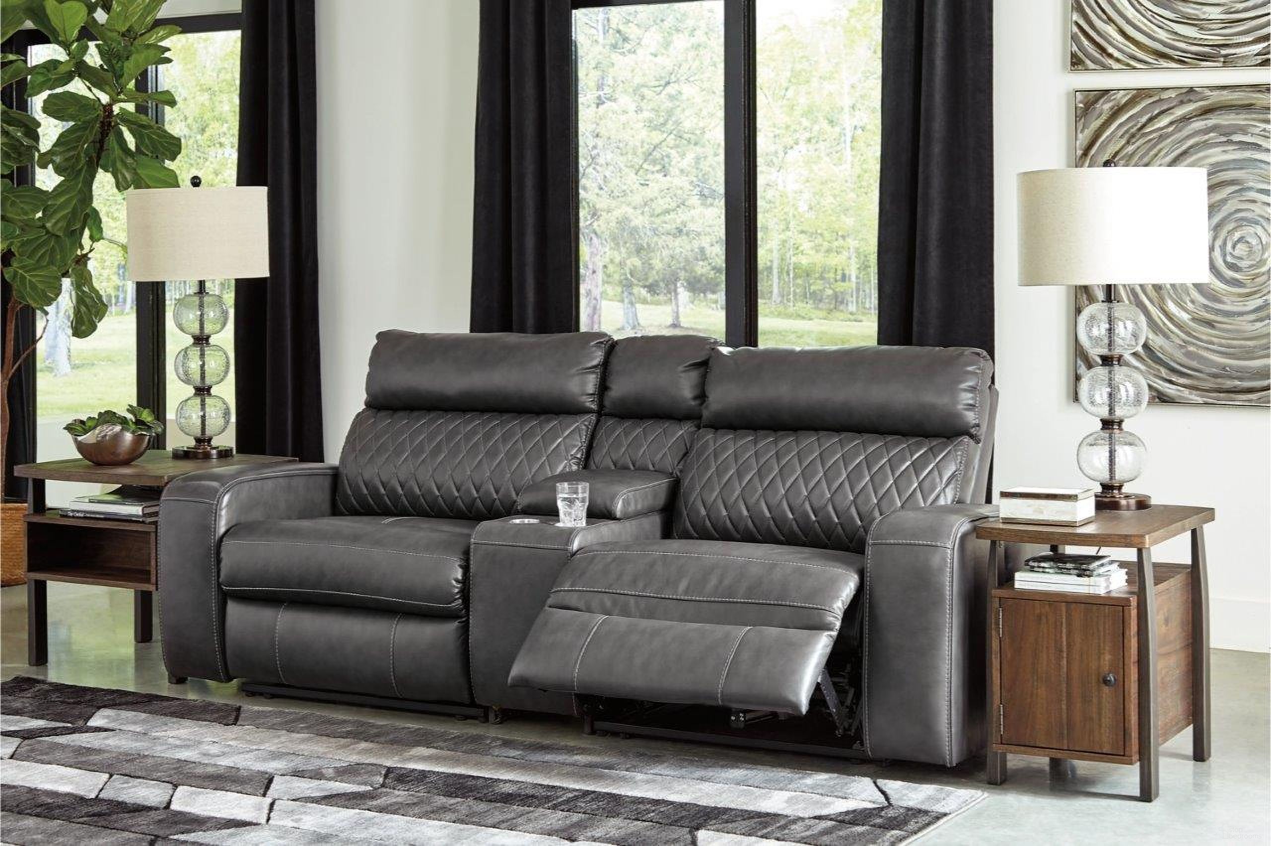 The appearance of Samperstone Power Reclining Console Loveseat In Gray designed by Signature Design by Ashley in the modern / contemporary interior design. This gray piece of furniture was selected by 1StopBedrooms from Samperstone Collection to add a touch of cosiness and style into your home. Sku: 5520357;5520358;5520362. Material: Faux Leather.