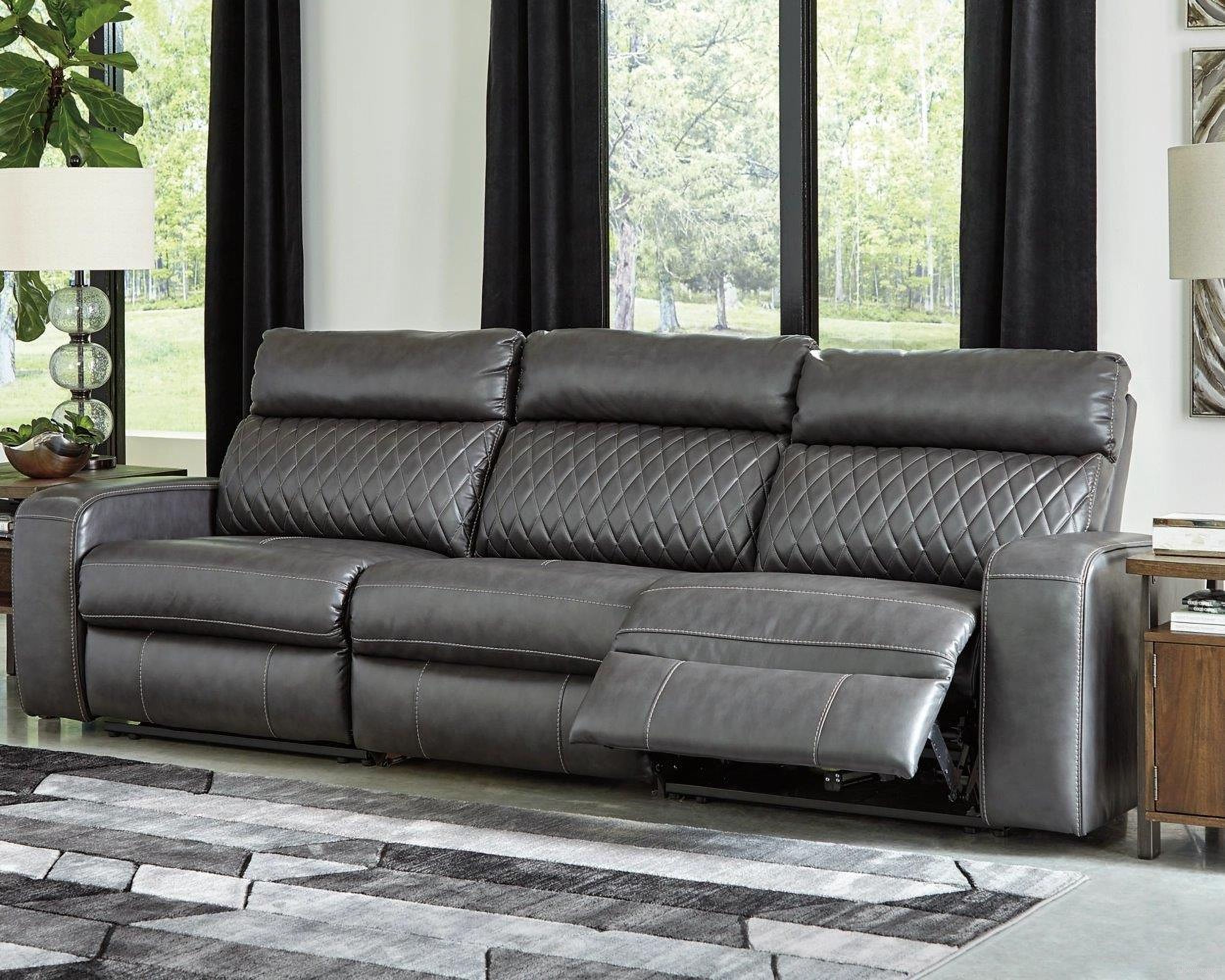 The appearance of Samperstone Power Reclining Sofa In Gray designed by Signature Design by Ashley in the modern / contemporary interior design. This gray piece of furniture was selected by 1StopBedrooms from Samperstone Collection to add a touch of cosiness and style into your home. Sku: 5520346;5520362;5520358. Material: Faux Leather.