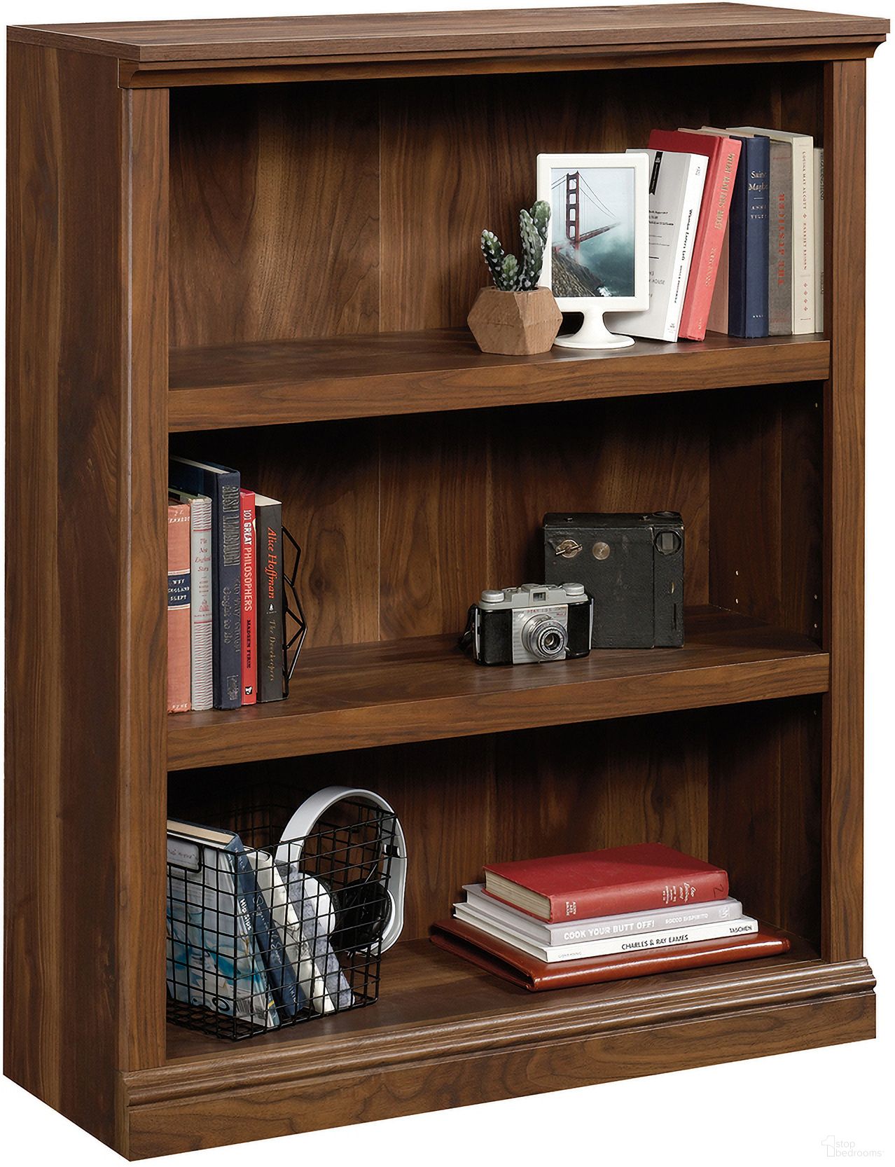 The appearance of Sauder Select 3-Shelf Bookcase In Grand Walnut designed by Sauder in the transitional interior design. This grand walnut piece of furniture was selected by 1StopBedrooms from Sauder Select Collection to add a touch of cosiness and style into your home. Sku: 426428. Material: Engineered Wood.