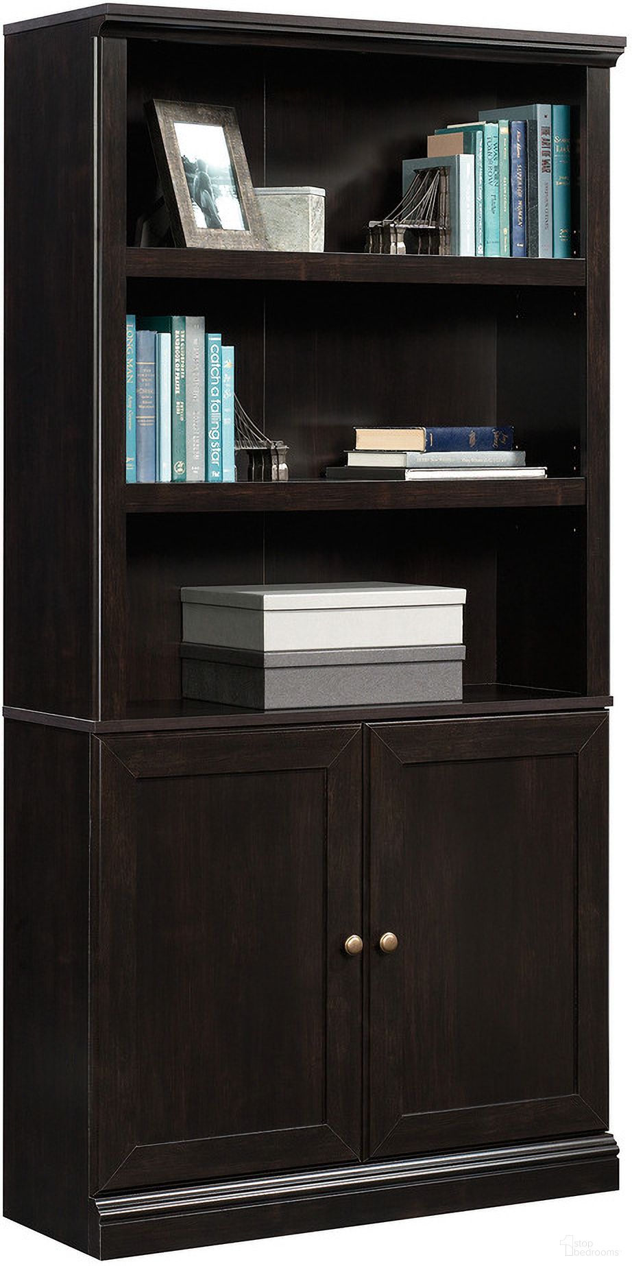 The appearance of Sauder Select Bookcase With Doors In Estate Black designed by Sauder in the transitional interior design. This estate black piece of furniture was selected by 1StopBedrooms from Sauder Select Collection to add a touch of cosiness and style into your home. Sku: 426412. Material: Engineered Wood.