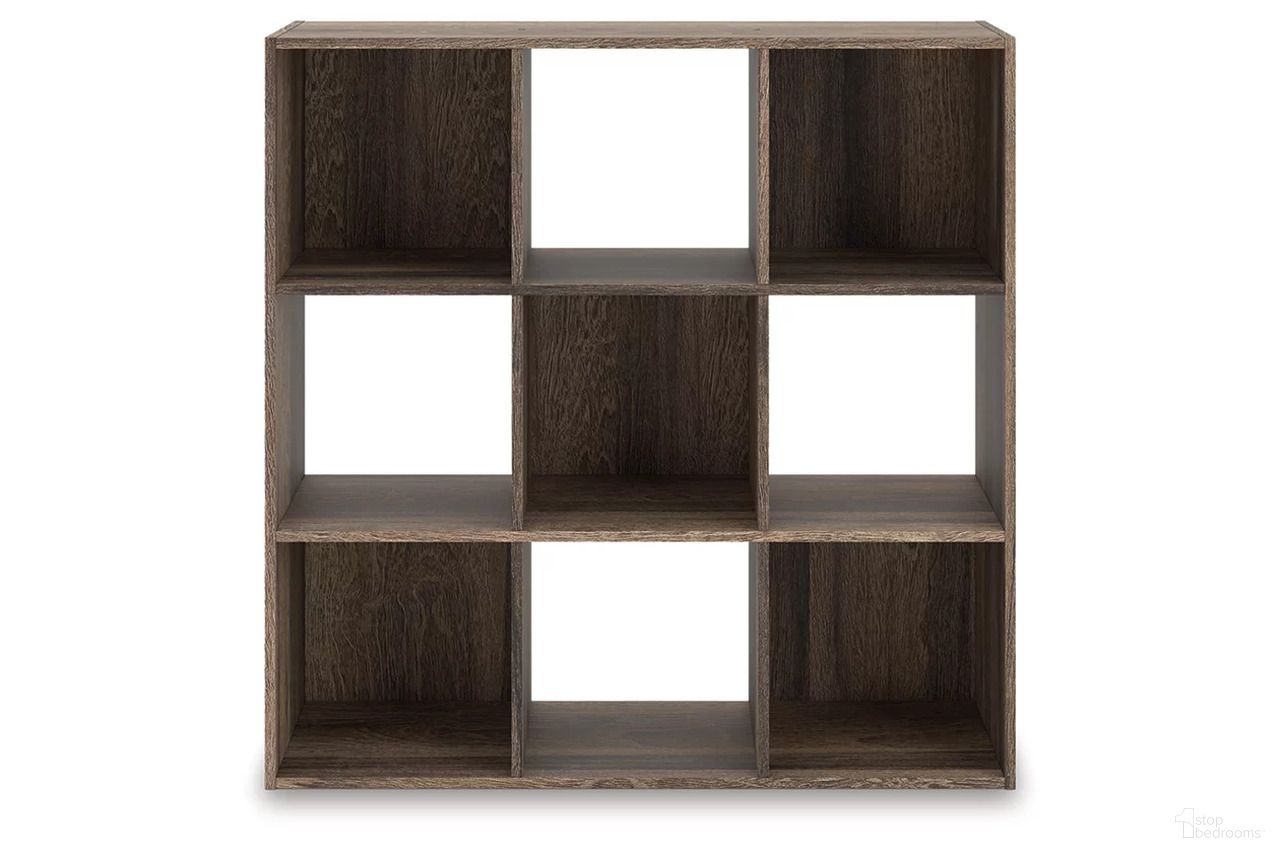 The appearance of Shallifer Nine Cube Organizer In Brown designed by Signature Design by Ashley in the transitional interior design. This brown piece of furniture was selected by 1StopBedrooms from Shallifer Collection to add a touch of cosiness and style into your home. Sku: EA1104-3X3. Material: Wood.