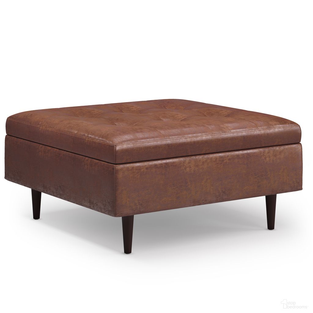 The appearance of Shay Vegan Faux Leather Mid Century Large Square Coffee Table Storage Ottoman In Distressed Saddle Brown designed by Simpli Home in the transitional interior design. This distressed saddle brown piece of furniture was selected by 1StopBedrooms from Shay Collection to add a touch of cosiness and style into your home. Sku: AXCOT-SHLS-DSB. Material: Faux Leather.