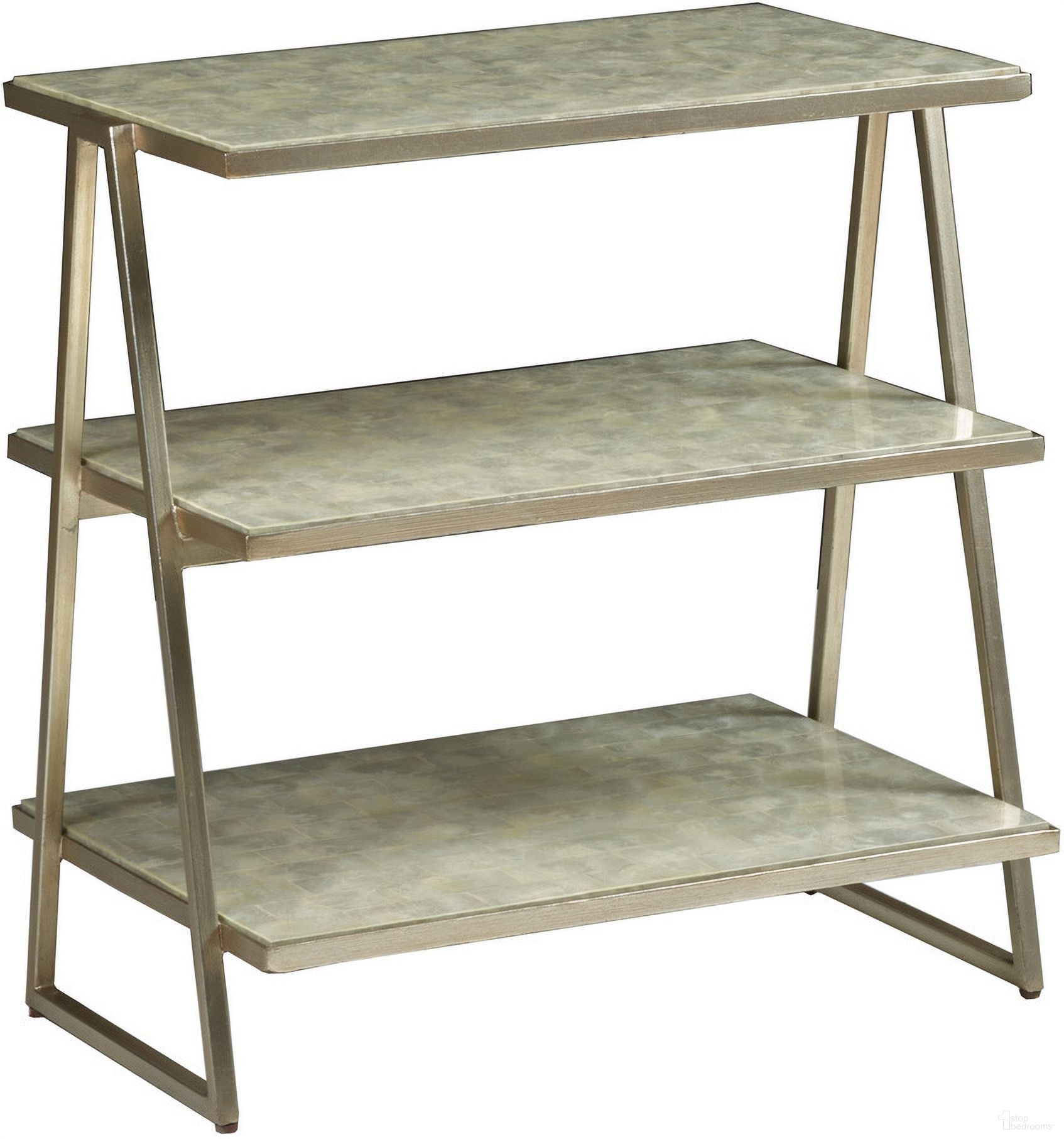 The appearance of Signature Designs Cumulus Capiz Triangular Tier Table In Champagne designed by Artistica Home in the transitional interior design. This champagne piece of furniture was selected by 1StopBedrooms from Signature Designs Collection to add a touch of cosiness and style into your home. Sku: 2156-958. Material: Metal.
