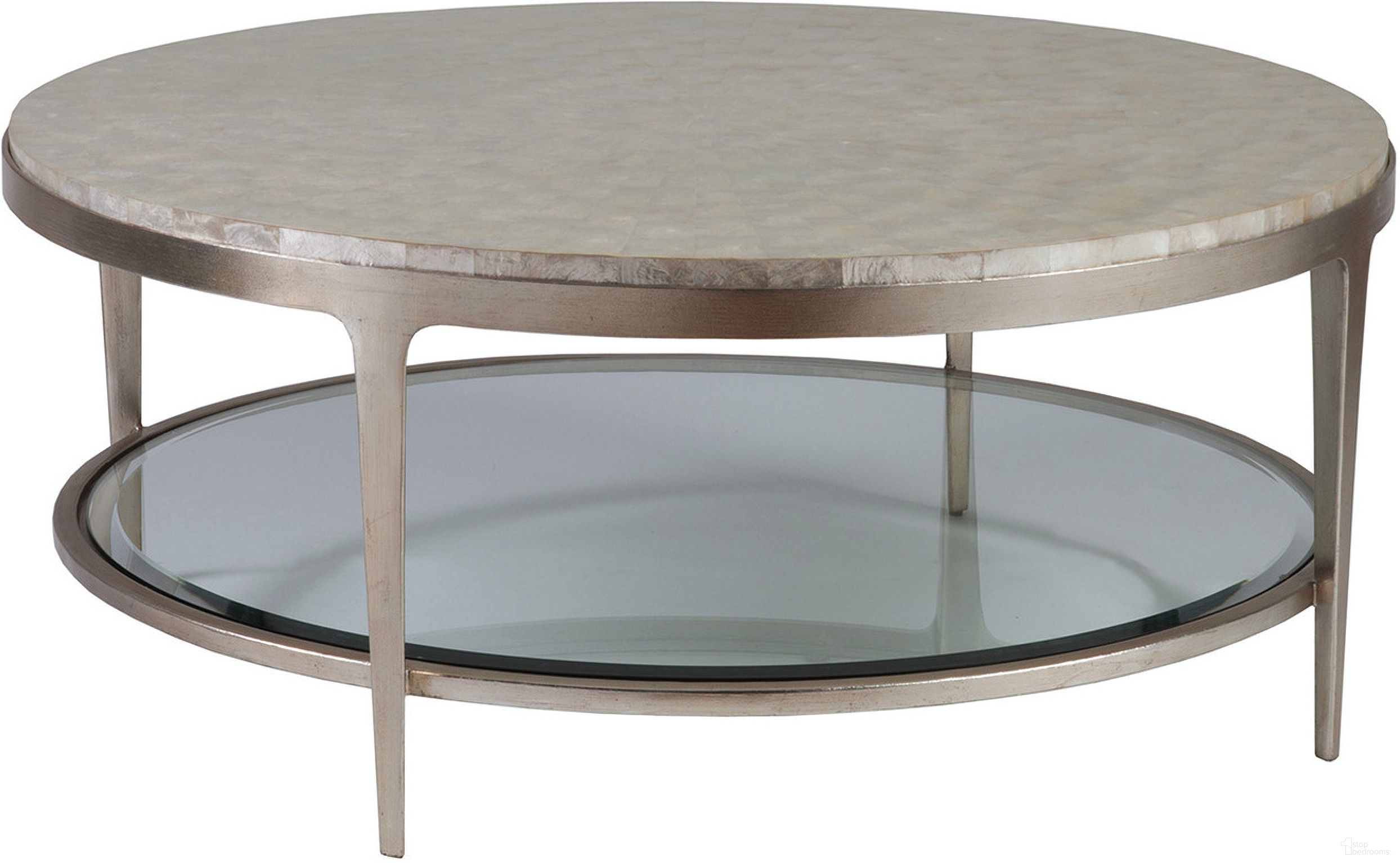 The appearance of Signature Designs Gravitas Round Cocktail Table In Champagne designed by Artistica Home in the transitional interior design. This champagne piece of furniture was selected by 1StopBedrooms from Signature Designs Collection to add a touch of cosiness and style into your home. Sku: 2050-943C. Material: Metal.