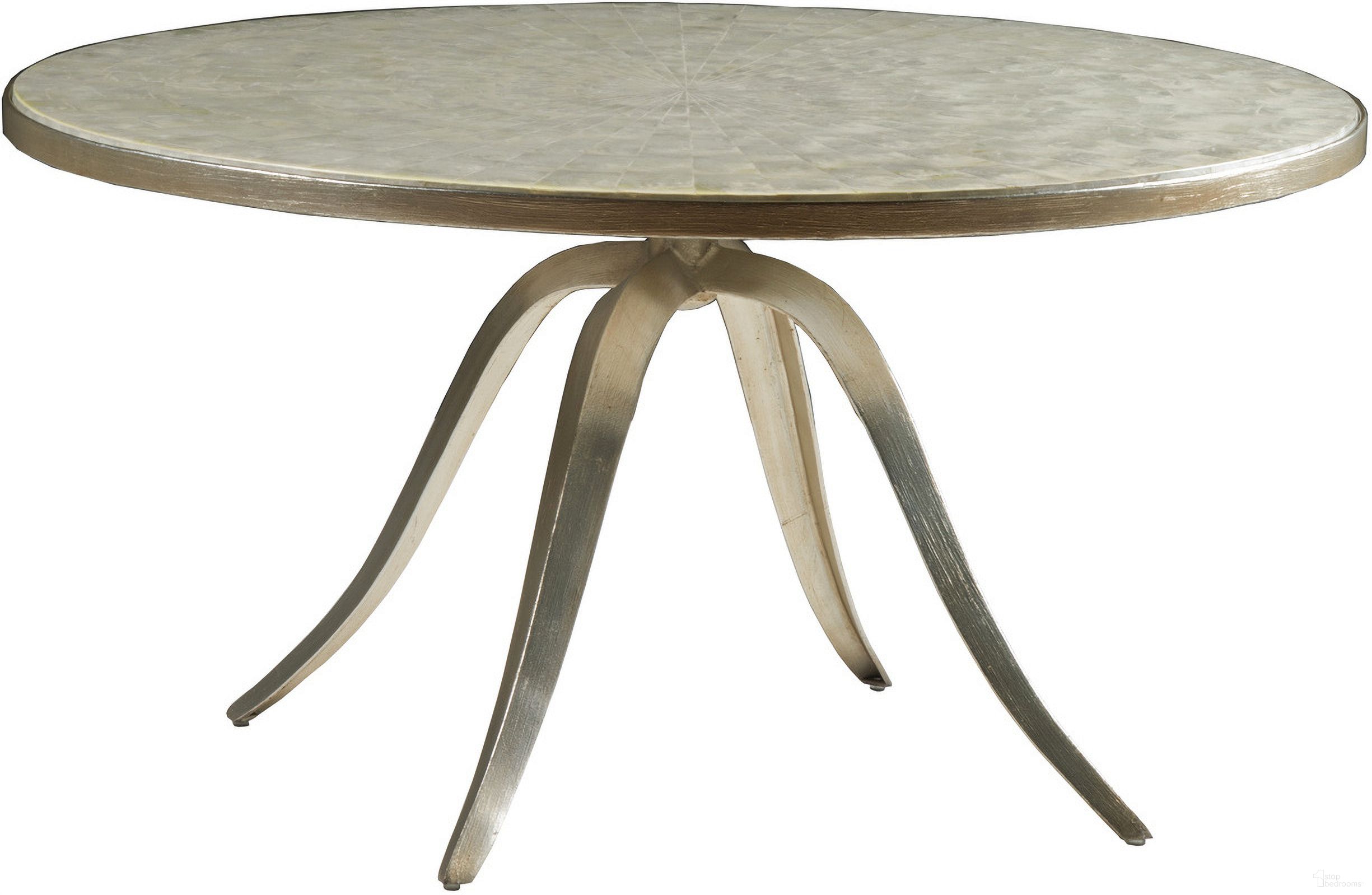 The appearance of Signature Designs Capiz Round Cocktail In Champagne designed by Artistica Home in the transitional interior design. This champagne piece of furniture was selected by 1StopBedrooms from Signature Designs Collection to add a touch of cosiness and style into your home. Sku: 2155-943. Material: Metal.