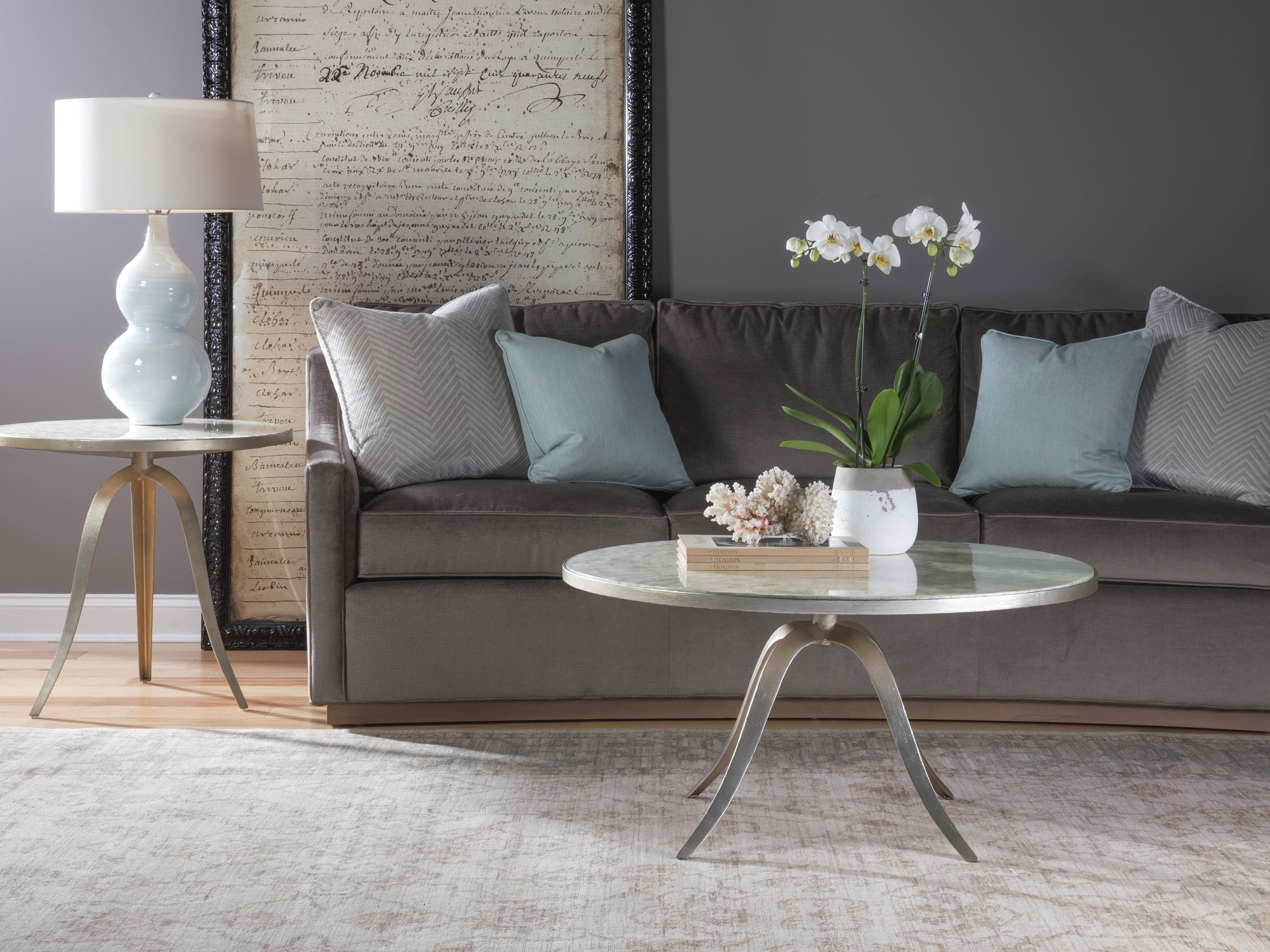 The appearance of Signature Designs Champagne Silver Foil Capiz Round Occasional Table Set designed by Artistica Home in the transitional interior design. This champagne piece of furniture was selected by 1StopBedrooms from Signature Designs Collection to add a touch of cosiness and style into your home. Sku: 2155-943;2155-950. Material: Metal.