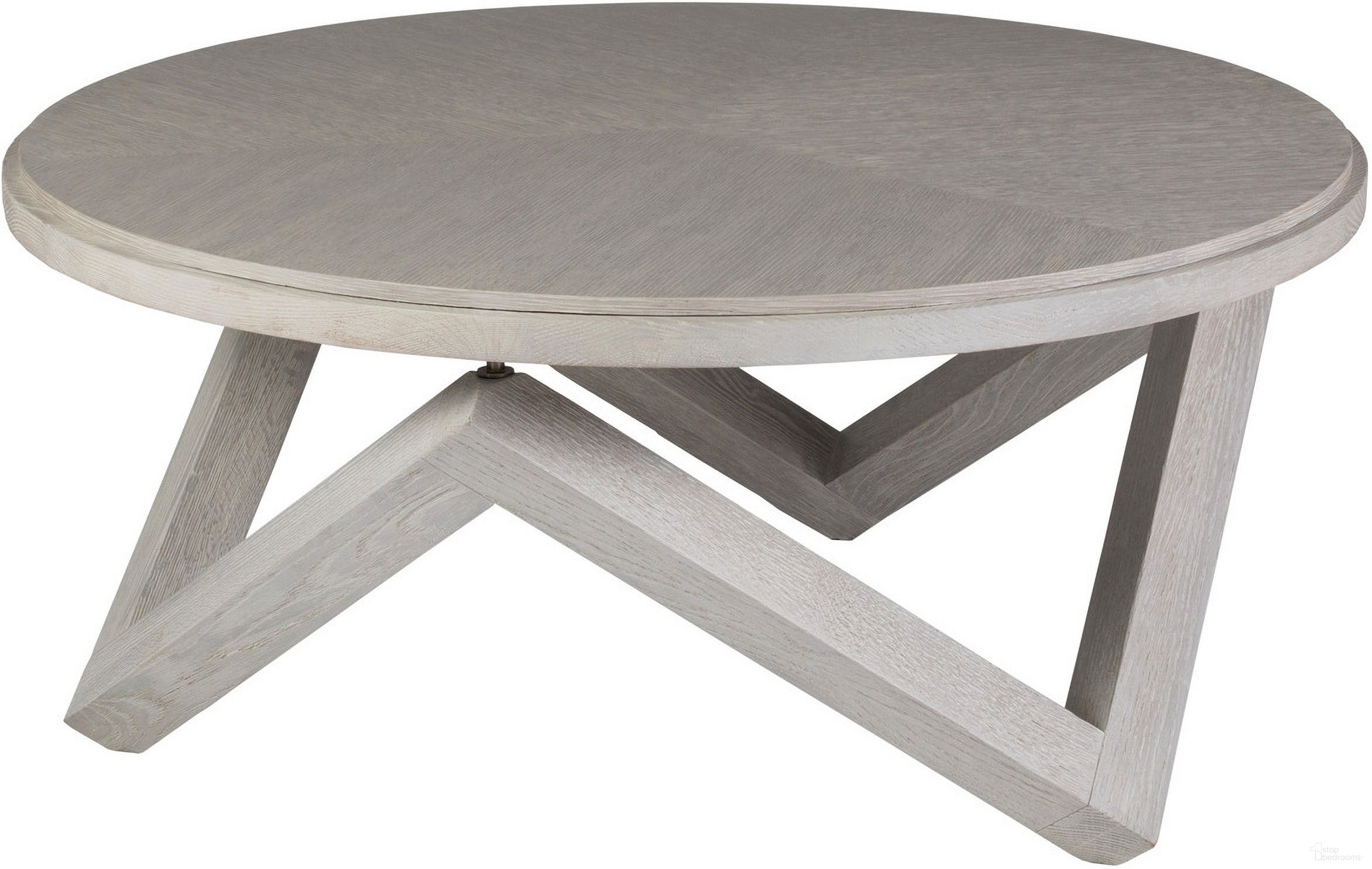 The appearance of Signature Designs Isoceles Round Cocktail Table In Mist Gray designed by Artistica Home in the modern / contemporary interior design. This mist gray piece of furniture  was selected by 1StopBedrooms from Signature Designs Collection to add a touch of cosiness and style into your home. Sku: 2282-943. Material: Wood.
