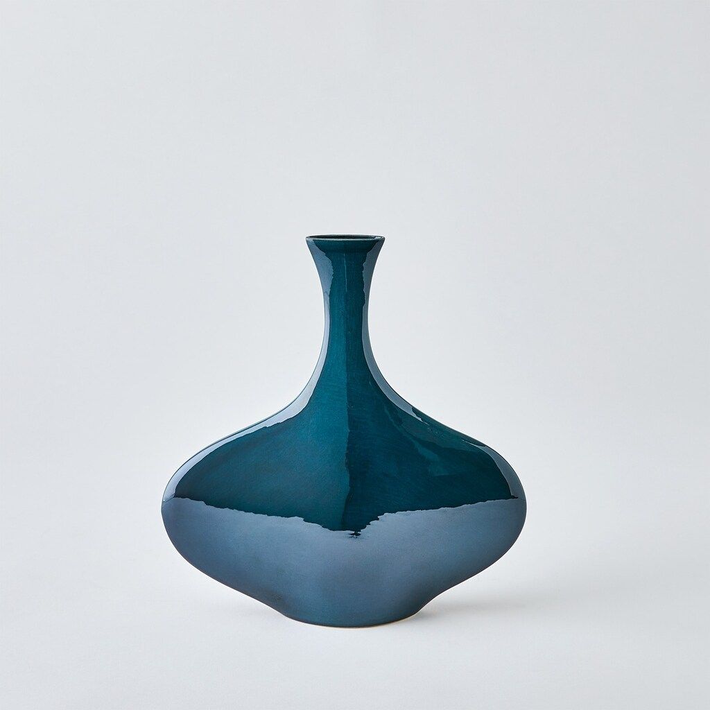 The appearance of Silhouette Wide Vase In Blue designed by Global Views in the modern / contemporary interior design. This blue piece of furniture  was selected by 1StopBedrooms from Silhouette Collection to add a touch of cosiness and style into your home. Sku: 111068. Material: Iron.