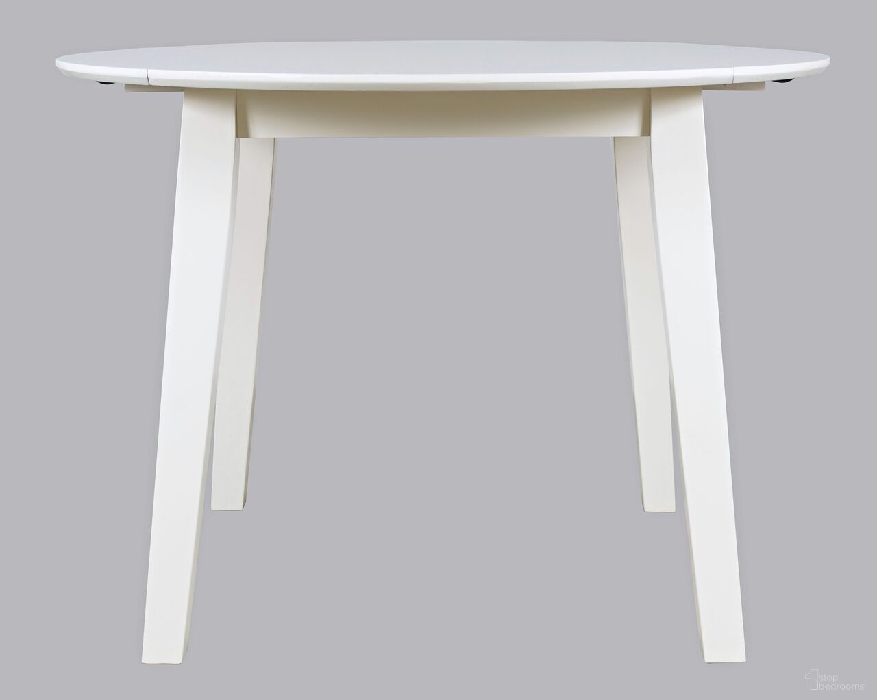 The appearance of Simplicity Round Drop Leaf Table In White designed by Jofran in the transitional interior design. This white piece of furniture  was selected by 1StopBedrooms from Simplicity Collection to add a touch of cosiness and style into your home. Sku: 652-28. Table Base Style: Legs. Table Top Shape: Round. Material: Rubberwood. Size: 42".