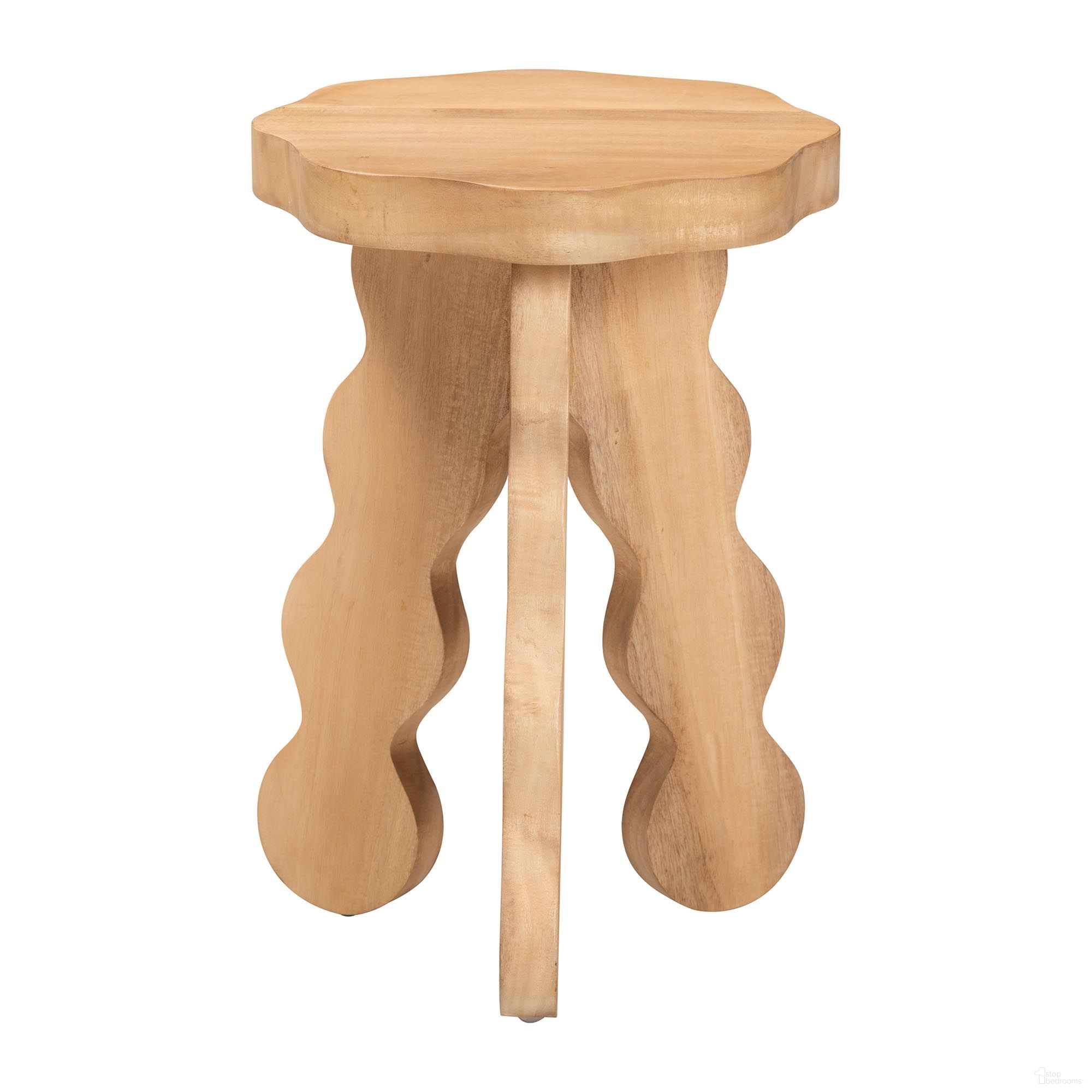 The appearance of Sino Acacia Wood Multipurpose Sculptural Accent Stool with Wavy Tripod Base In Natural Brown designed by Baxton Studio in the rustic / southwestern interior design. This natural brown piece of furniture  was selected by 1StopBedrooms from Sino Collection to add a touch of cosiness and style into your home. Sku: Sino-Natural-Stool. Material: Acacia Wood.