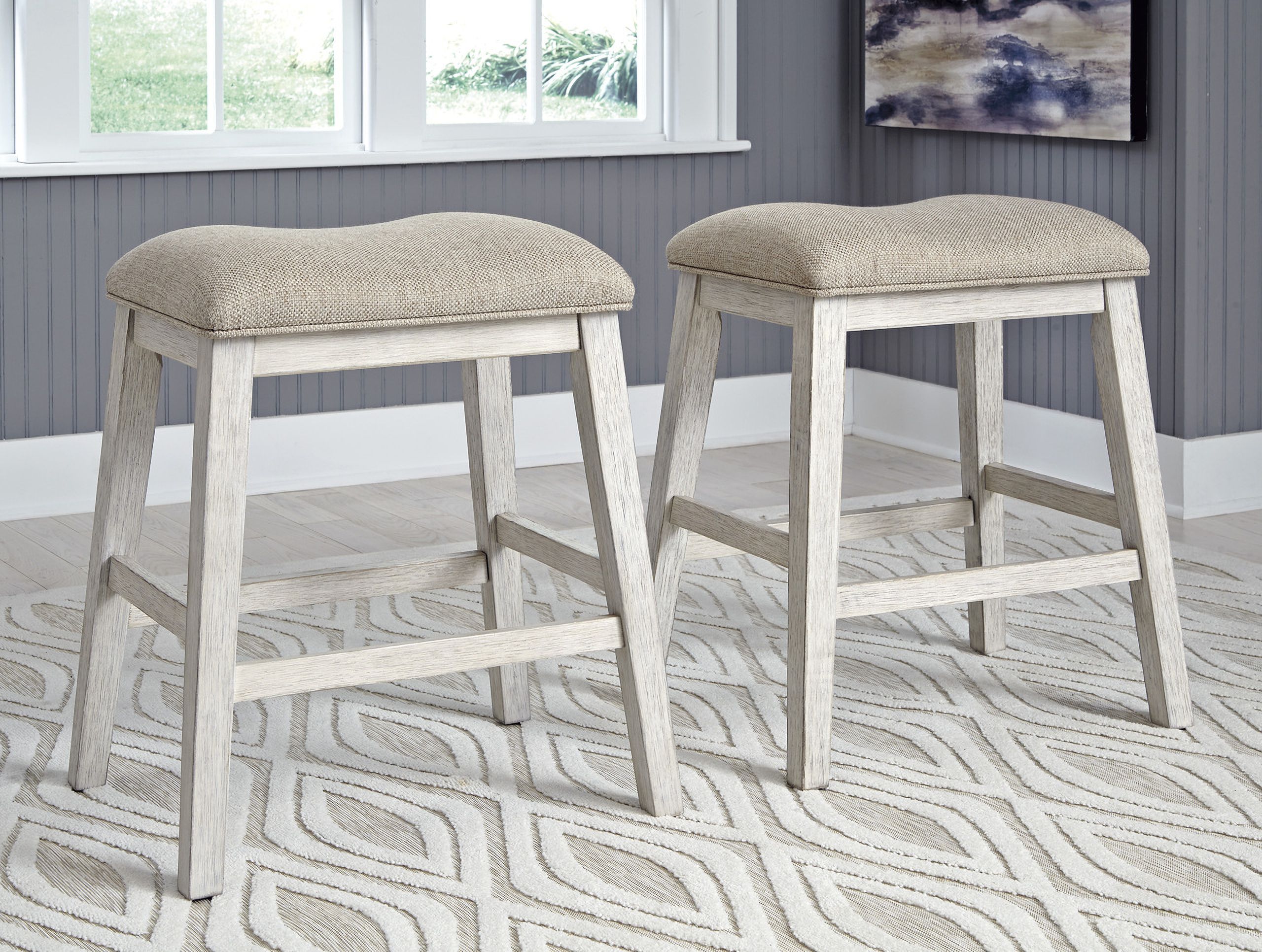 The appearance of Skempton White And Light Brown Counter Height Bar Stool Set of 2 designed by Signature Design by Ashley in the transitional interior design. This white/light brown piece of furniture was selected by 1StopBedrooms from Skempton Collection to add a touch of cosiness and style into your home. Sku: D394-024. Material: Fabric.