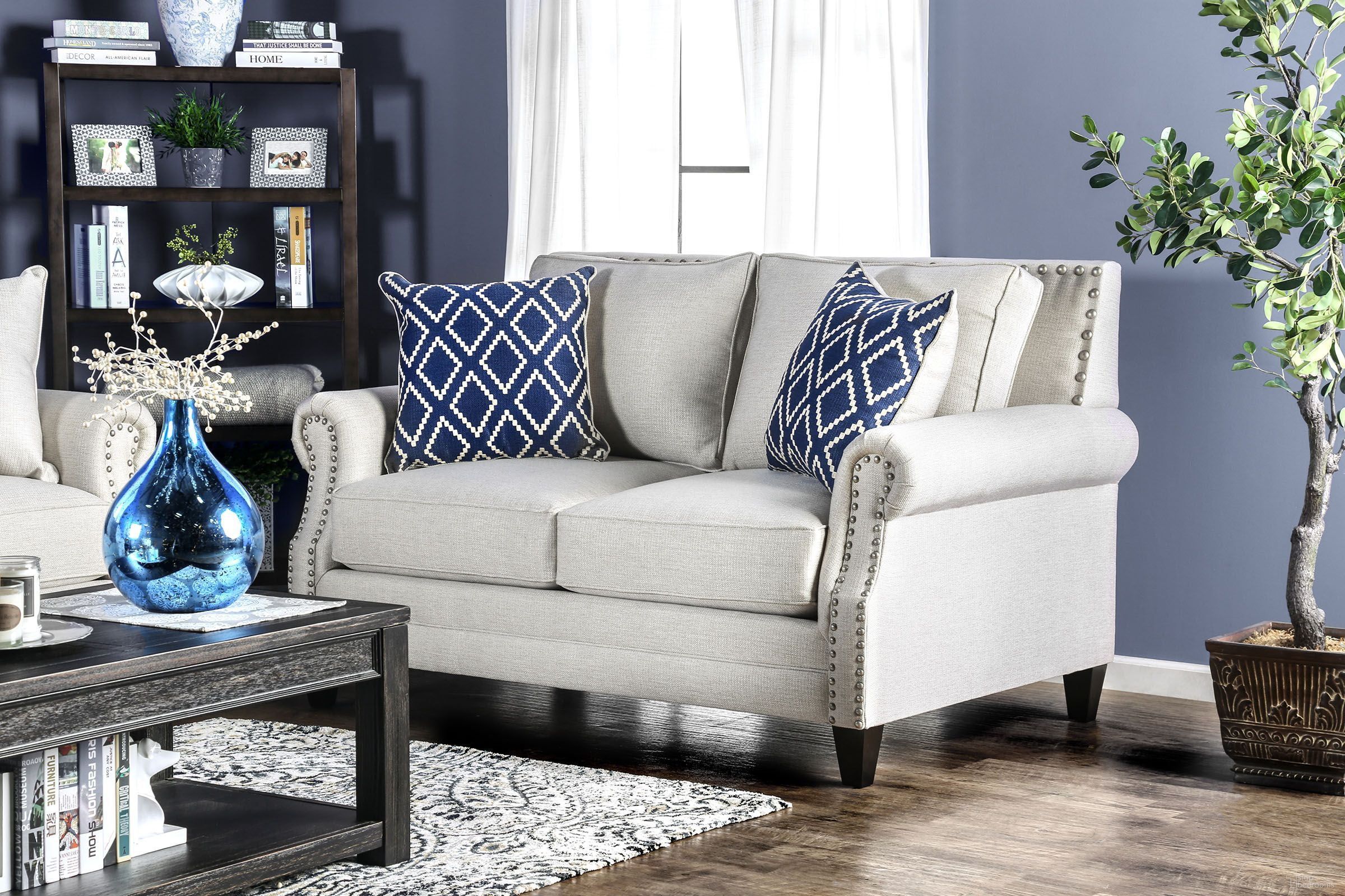 The appearance of Giovanni Beige Loveseat designed by Furniture of America in the transitional interior design. This beige piece of furniture  was selected by 1StopBedrooms from Giovanni Collection to add a touch of cosiness and style into your home. Sku: SM2672-LV. Material: Polyester. Key Features: Nailhead Trim.