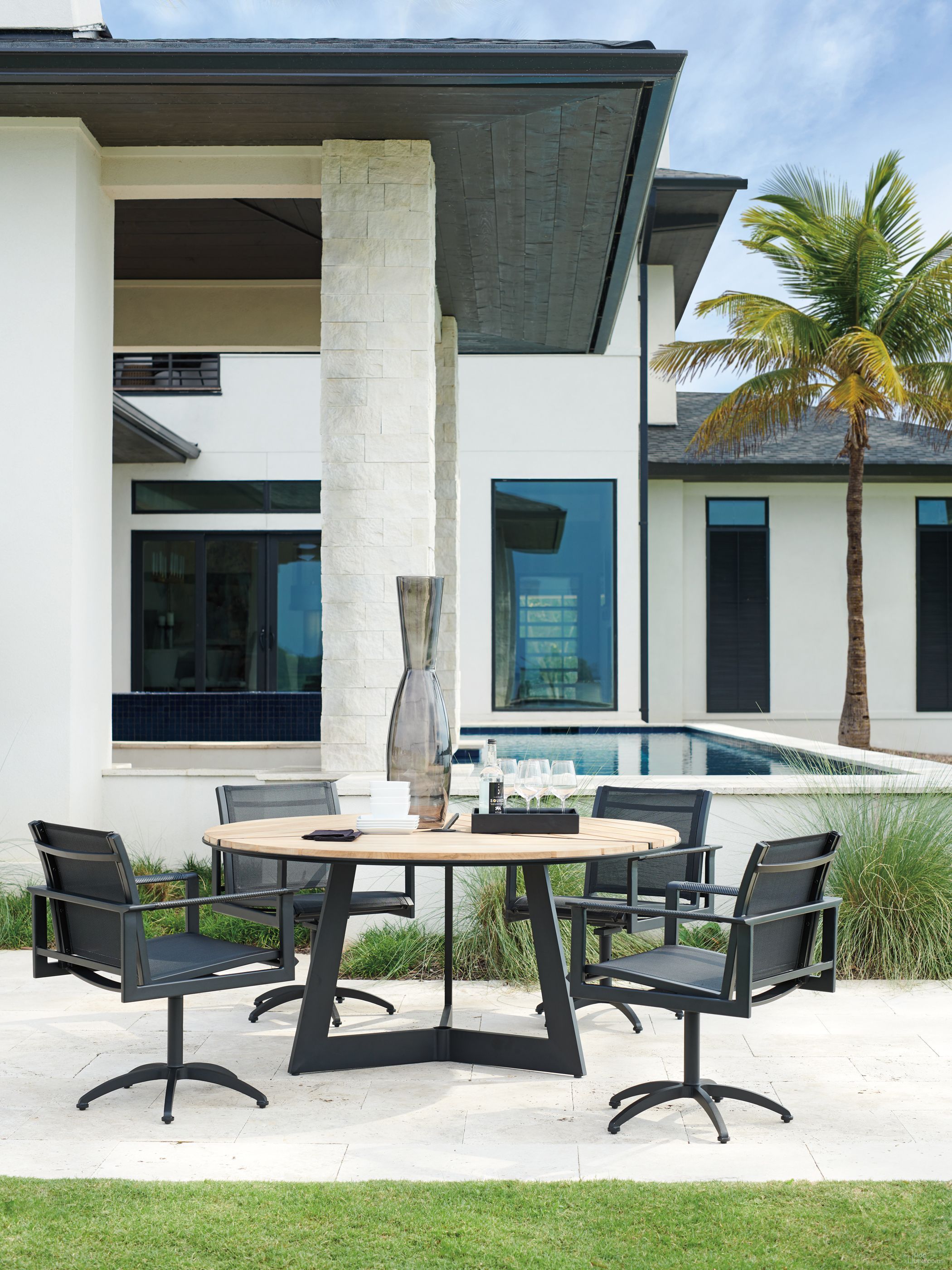 The appearance of South Beach Obsidian Outdoor Round Dining Table Set designed by Tommy Bahama in the modern / contemporary interior design. This obsidian piece of furniture was selected by 1StopBedrooms from South Beach Collection to add a touch of cosiness and style into your home. Sku: 3940-875C;3940-13. Table Base Style: Trestle. Table Top Shape: Round. Material: Aluminum.