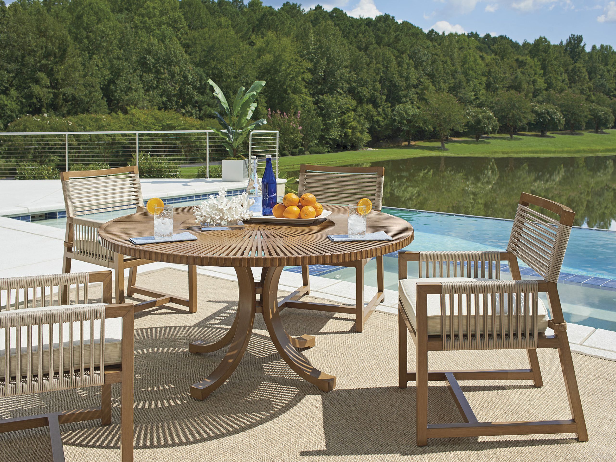 The appearance of St Tropez Round Dining Room Set In Medium Brown designed by Tommy Bahama in the modern / contemporary interior design. This medium brown piece of furniture  was selected by 1StopBedrooms from St Tropez Collection to add a touch of cosiness and style into your home. Sku: 3925-875C;3925-13-41. Table Top Shape: Round. Material: Aluminum. Size: 60".