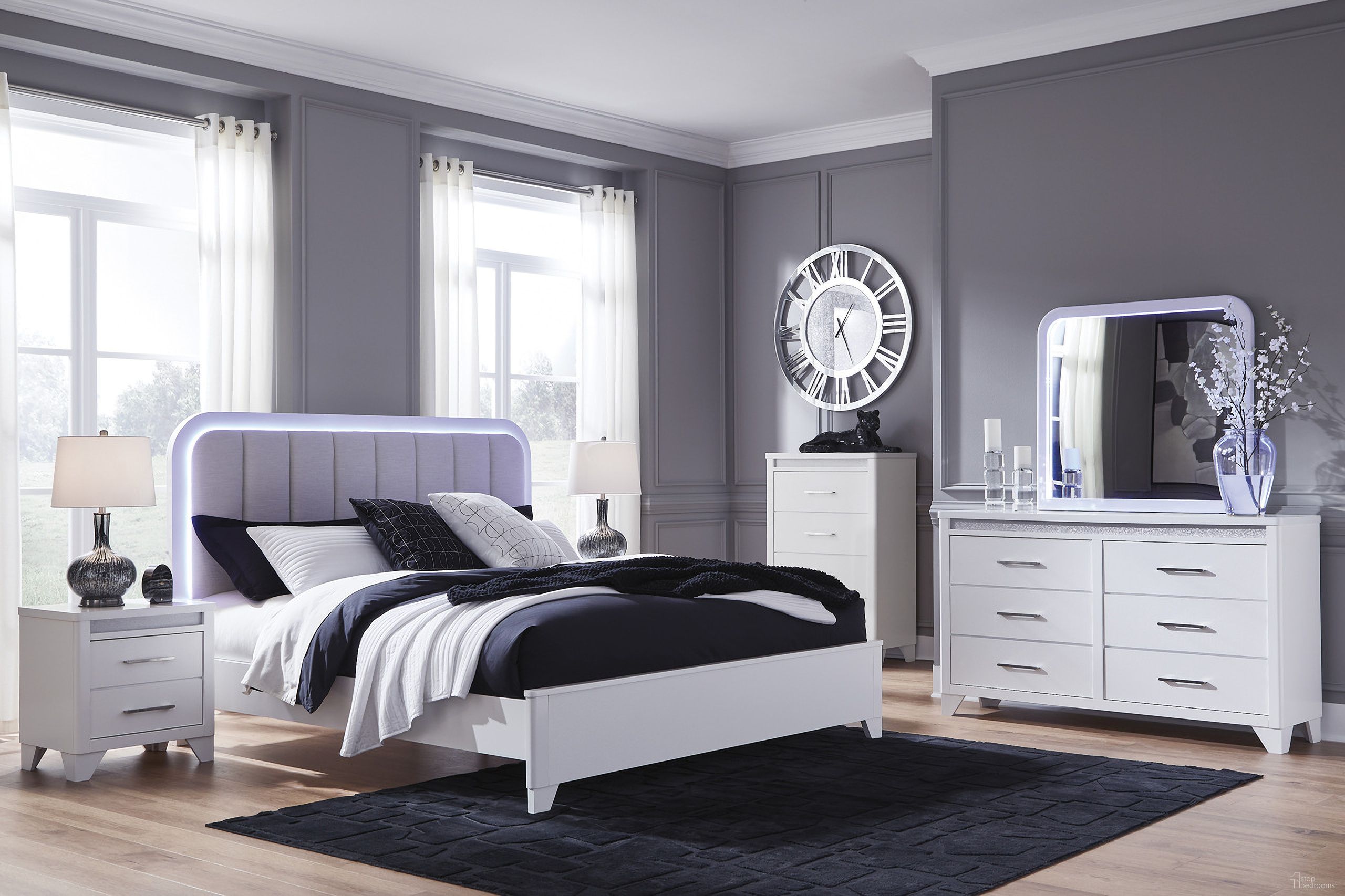 The appearance of Stenluxe Upholstered Panel Bedroom Set In White designed by Signature Design by Ashley in the modern / contemporary interior design. This white piece of furniture was selected by 1StopBedrooms from Stenluxe Collection to add a touch of cosiness and style into your home. Sku: NCB392-56;NCB392-58;NCB392-92. Bed Size: California King. Material: Hardwood.