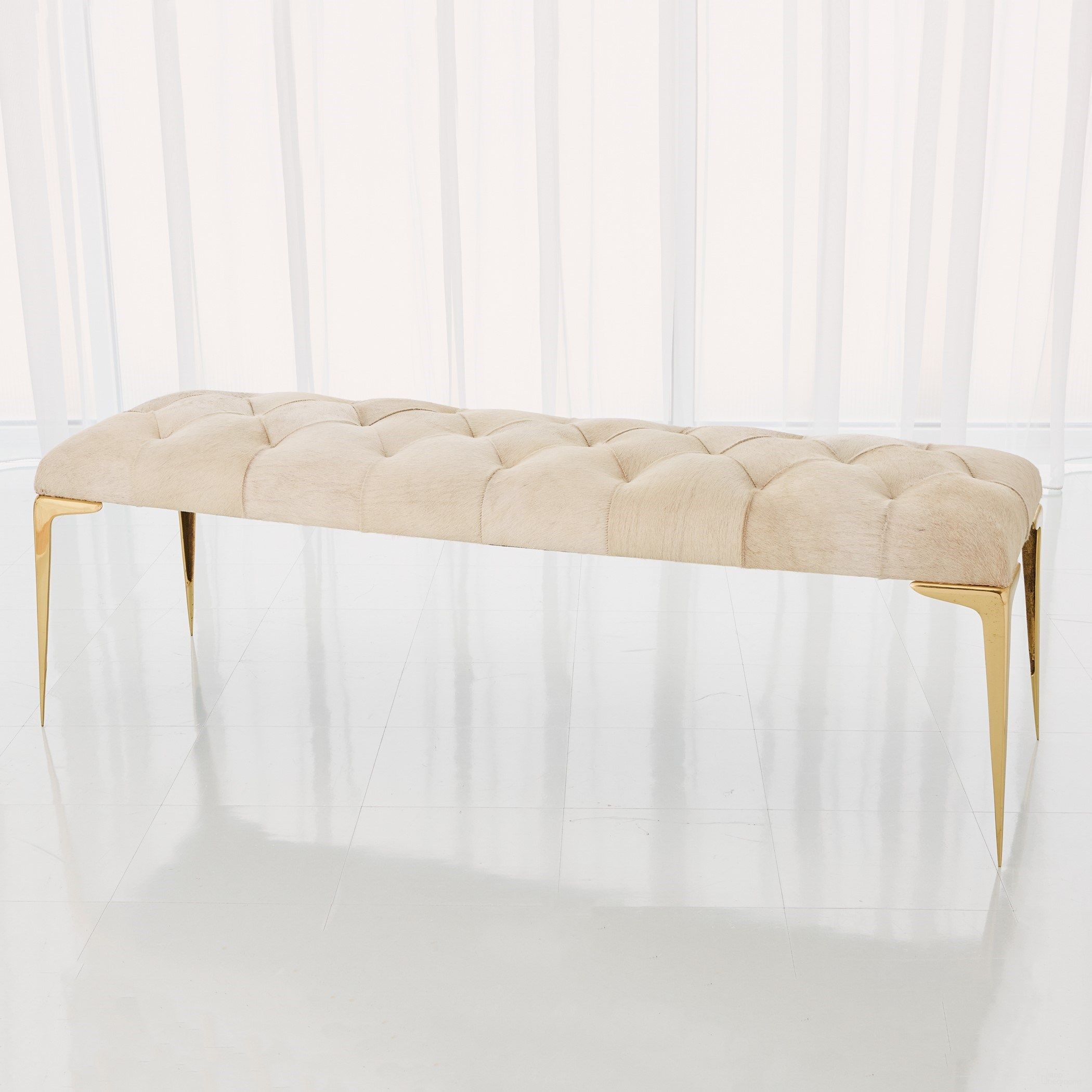 The appearance of Stiletto Bench In White Hair On Hide designed by Global Views in the modern / contemporary interior design. This white piece of furniture was selected by 1StopBedrooms from Stiletto Collection to add a touch of cosiness and style into your home. Sku: 992725. Material: Brass.