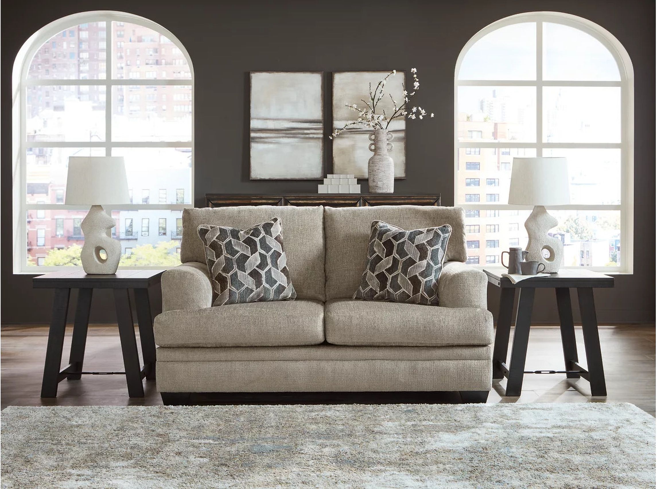 The appearance of Stonemeade Loveseat In Taupe designed by Signature Design by Ashley in the modern / contemporary interior design. This taupe piece of furniture  was selected by 1StopBedrooms from Stonemeade Collection to add a touch of cosiness and style into your home. Sku: 5950435. Material: Fabric.