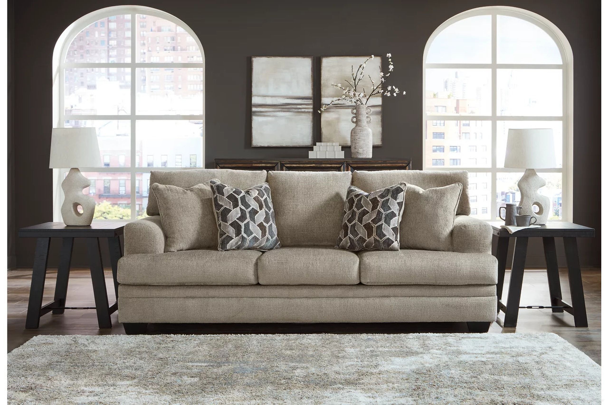 The appearance of Stonemeade Sofa In Taupe designed by Signature Design by Ashley in the modern / contemporary interior design. This taupe piece of furniture was selected by 1StopBedrooms from Stonemeade Collection to add a touch of cosiness and style into your home. Sku: 5950438. Material: Fabric.