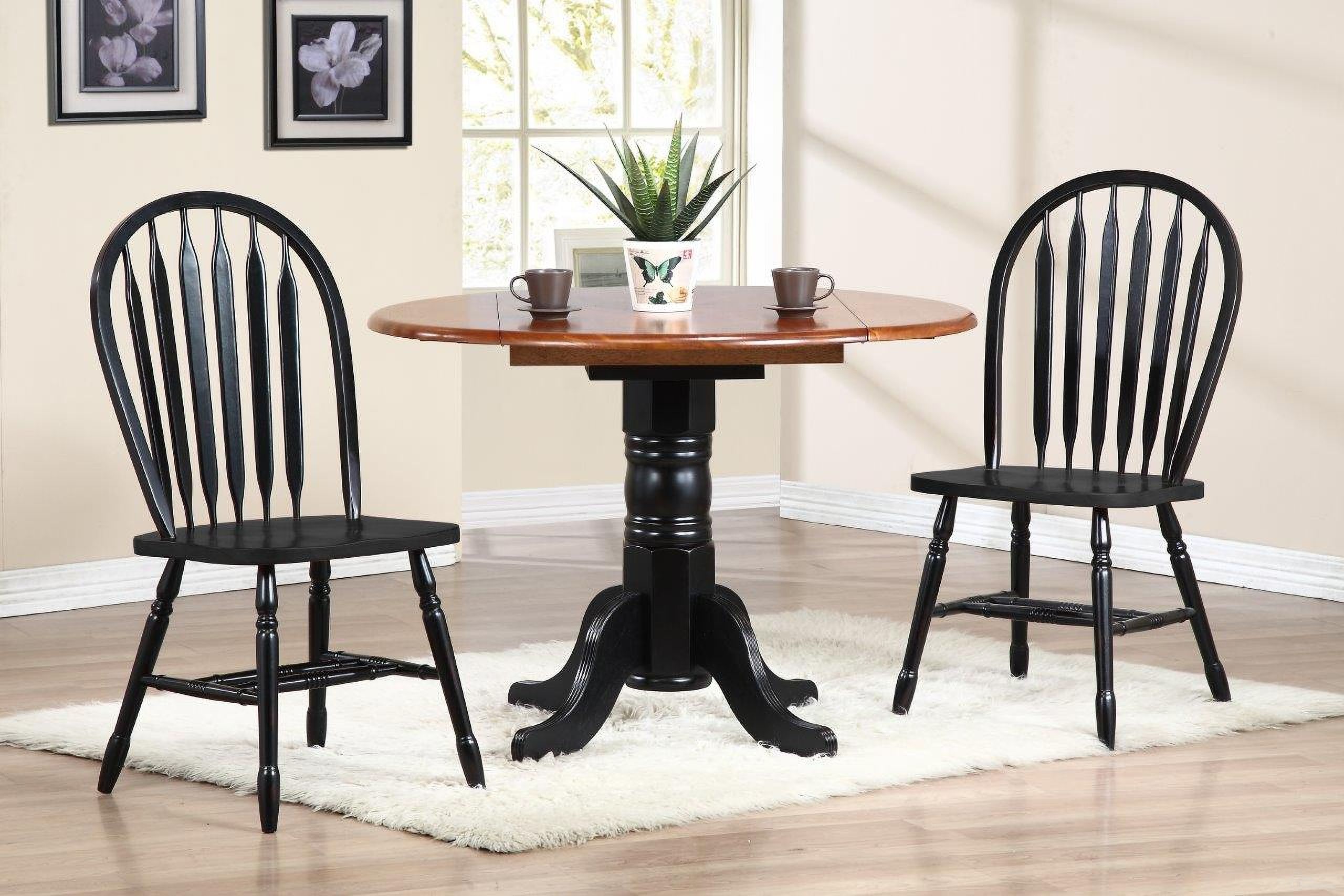 The appearance of Sunset Trading Black Cherry Selections 3 Piece 42 Inch Round Drop Leaf Dining Set with Arrowback Chairs designed by Sunset Trading in the modern / contemporary interior design. This antique black and cherry piece of furniture  was selected by 1StopBedrooms from Black Cherry Selections Collection to add a touch of cosiness and style into your home. Sku: DLU-TPD-4242-BCH-T;DLU-TPD-4242-BCH-B;DLU-820-AB-2. Material: Wood.