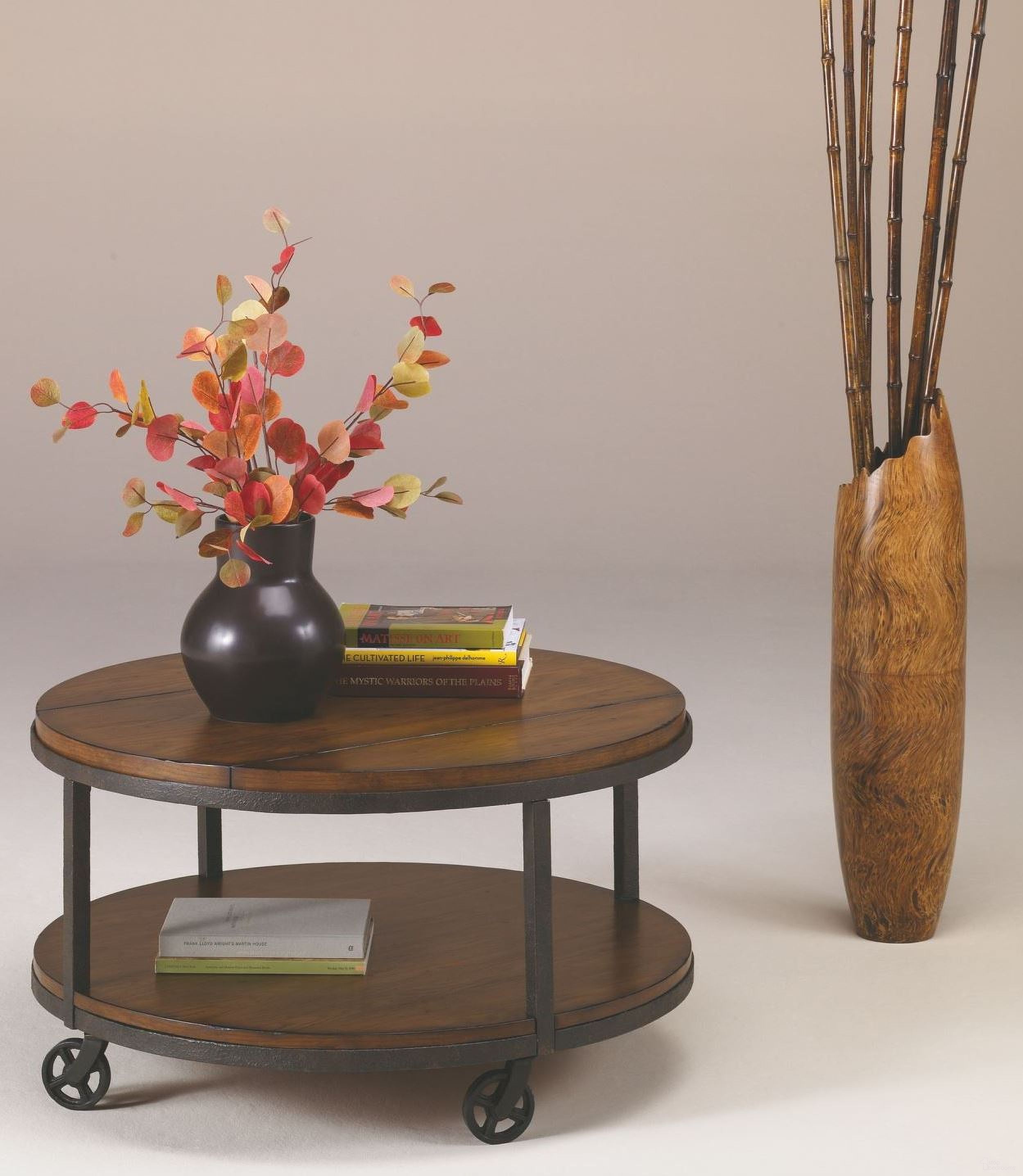 The appearance of Baja Round Occasional Table Set designed by Hammary in the transitional interior design. This brown piece of furniture  was selected by 1StopBedrooms from Baja Collection to add a touch of cosiness and style into your home. Sku: T20750-T2075205-00;T20750-T2075235-00. Material: Wood.