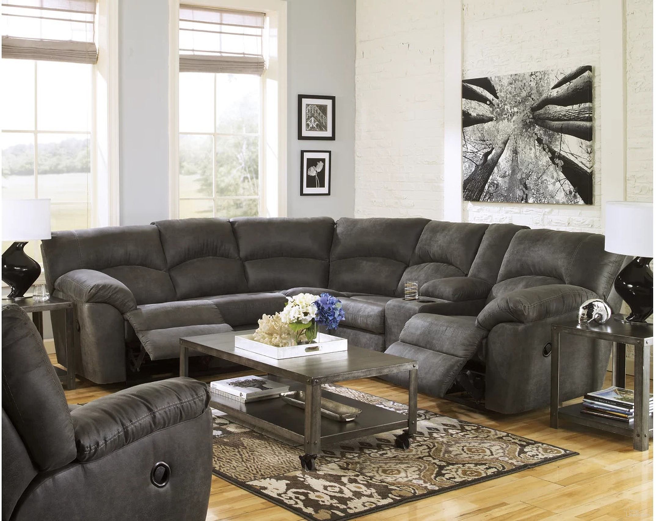 The appearance of Tambo 2-Piece Sectional with Recliner In Pewter designed by Signature Design by Ashley in the modern / contemporary interior design. This pewter piece of furniture  was selected by 1StopBedrooms from Tambo Collection to add a touch of cosiness and style into your home. Sku: 2780148;2780125;2780149. Material: Leather.