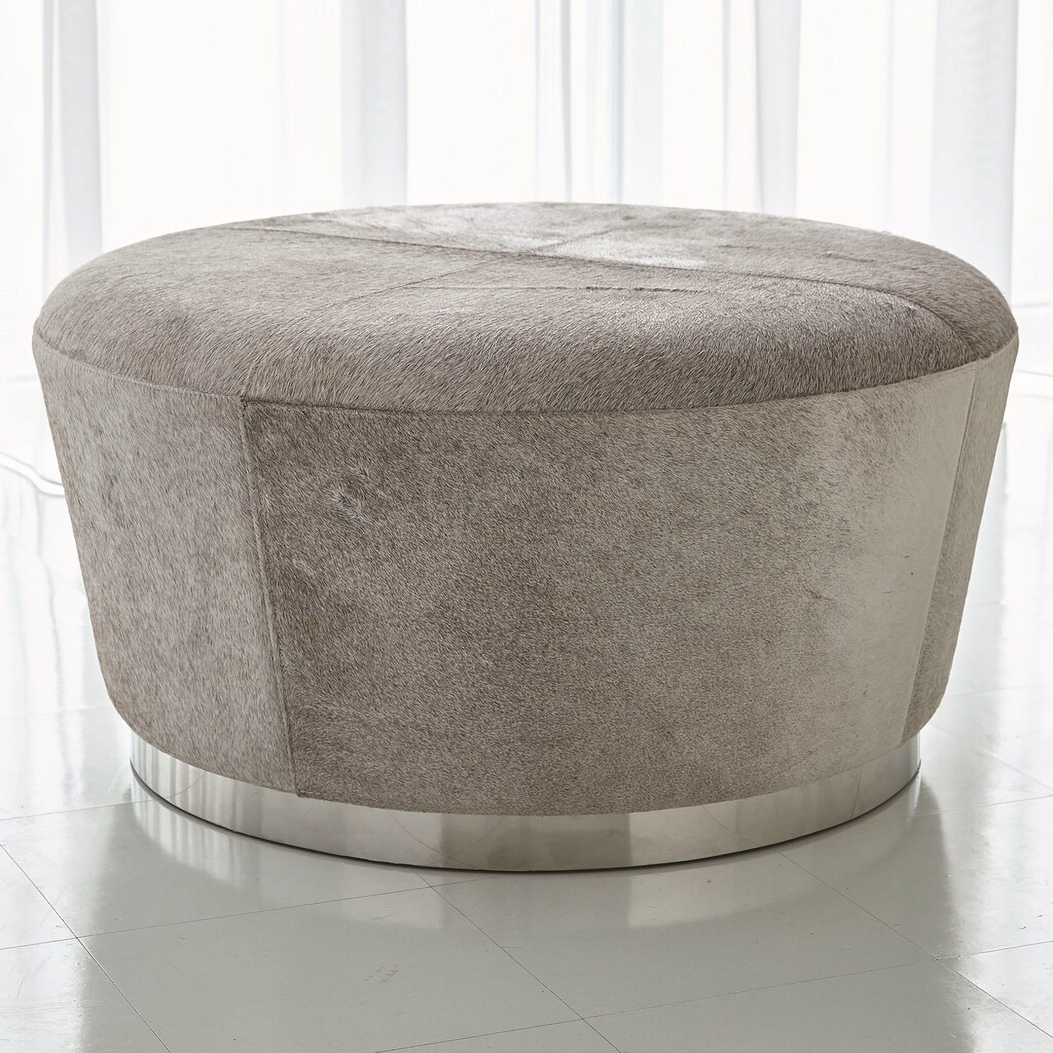 The appearance of Tapered Ottoman In Grey Hair On Hide designed by Global Views in the modern / contemporary interior design. This gray piece of furniture was selected by 1StopBedrooms from to add a touch of cosiness and style into your home. Sku: 790904. Material: Leather.