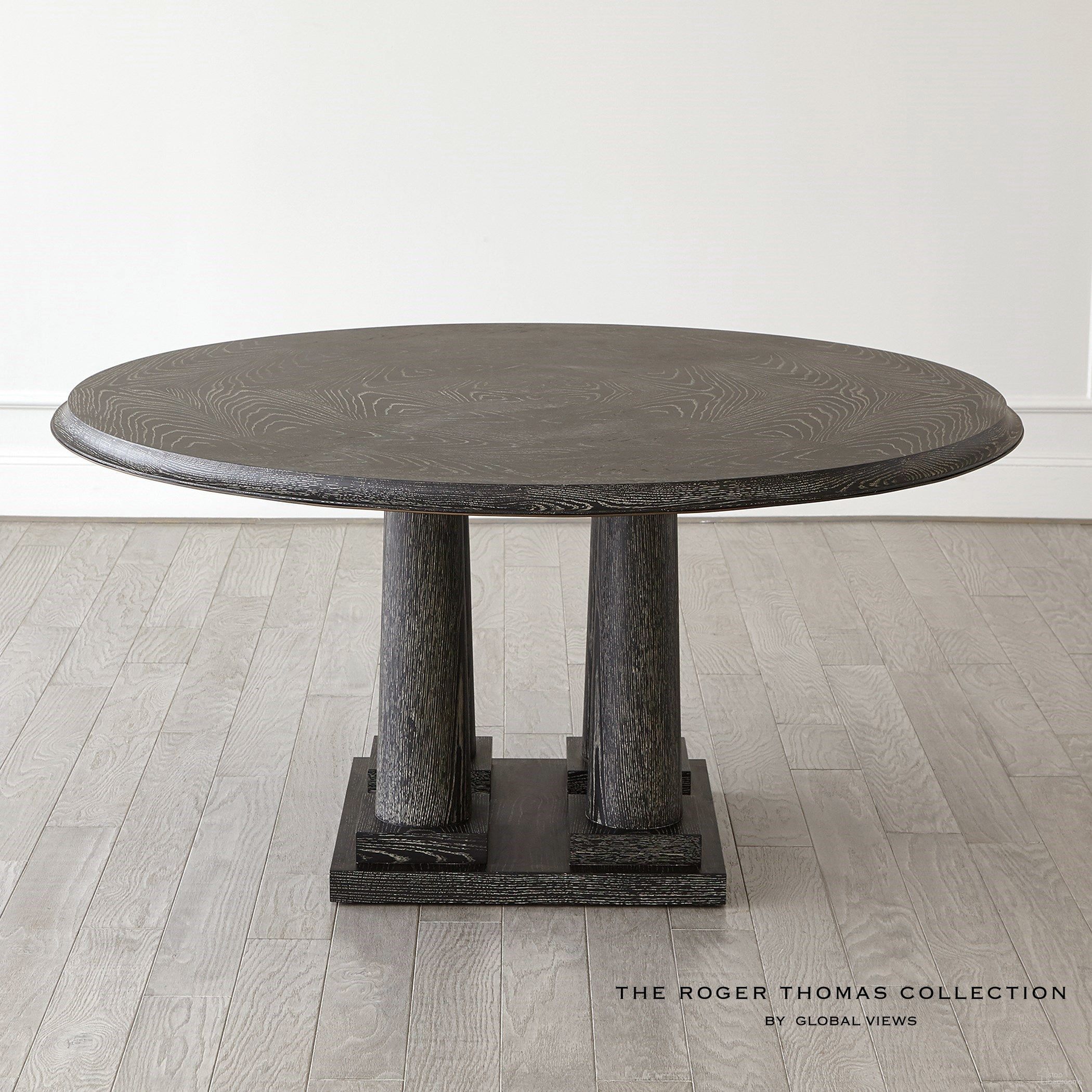 The appearance of Titian 60 Inch Top Dining Table In Black Cerused Oak designed by Global Views in the modern / contemporary interior design. This black piece of furniture  was selected by 1StopBedrooms from  to add a touch of cosiness and style into your home. Sku: RT2014. Table Base Style: Pedestal. Table Top Shape: Round. Material: Wood. Size: 60".