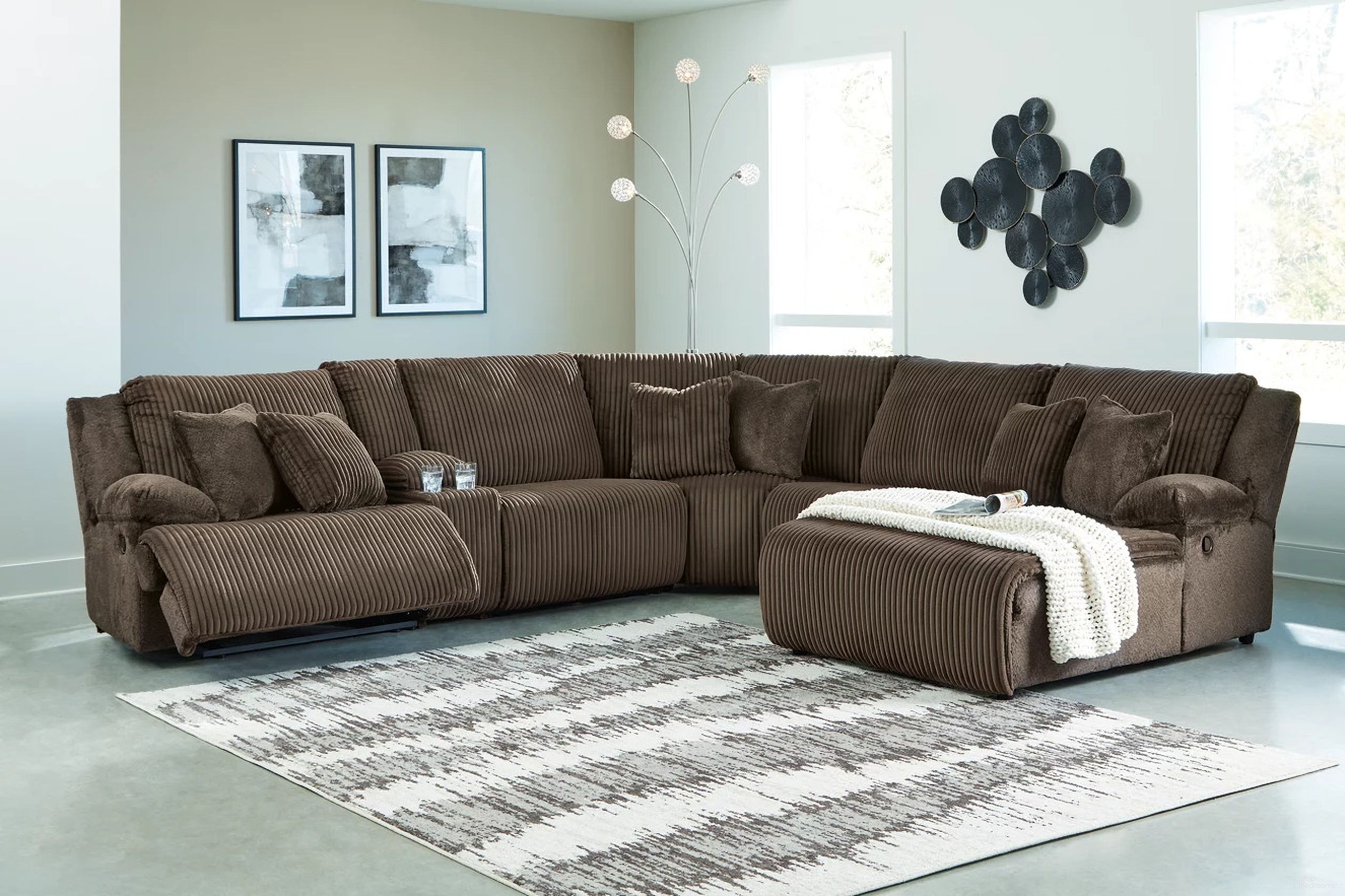 The appearance of Top Tier 6-Piece Reclining Sectional with Chaise In Chocolate designed by Signature Design by Ashley in the modern / contemporary interior design. This chocolate piece of furniture was selected by 1StopBedrooms from Top Tier Collection to add a touch of cosiness and style into your home. Sku: 9270540;9270519;9270546;9270557;9270577;9270507. Material: Polyester. Layout: U-Shape. Orientation: RAF.