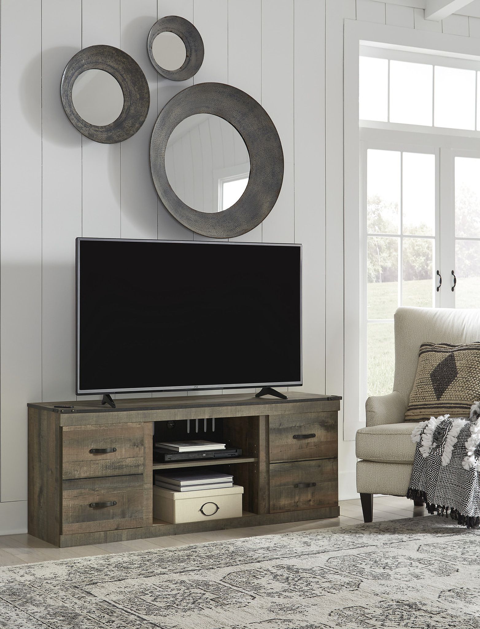 The appearance of Trinell Brown Lg Tv Stand W/Fireplace Option designed by Signature Design by Ashley in the transitional interior design. This brown piece of furniture was selected by 1StopBedrooms from Trinell Collection to add a touch of cosiness and style into your home. Sku: EW0446-268. Material: Wood.