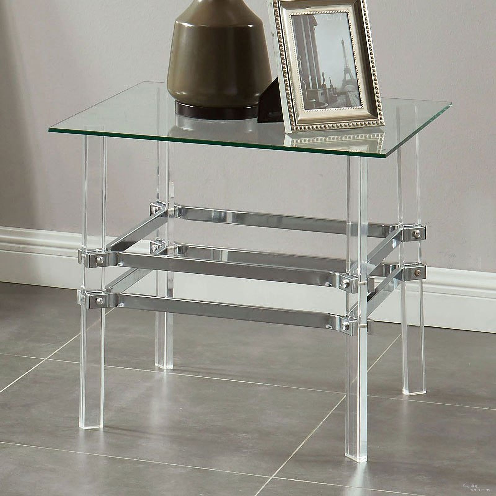 The appearance of Trofa Chrome End Table designed by Furniture of America in the modern / contemporary interior design. This silver piece of furniture  was selected by 1StopBedrooms from Trofa Collection to add a touch of cosiness and style into your home. Sku: CM4351E. Material: Acrylic.