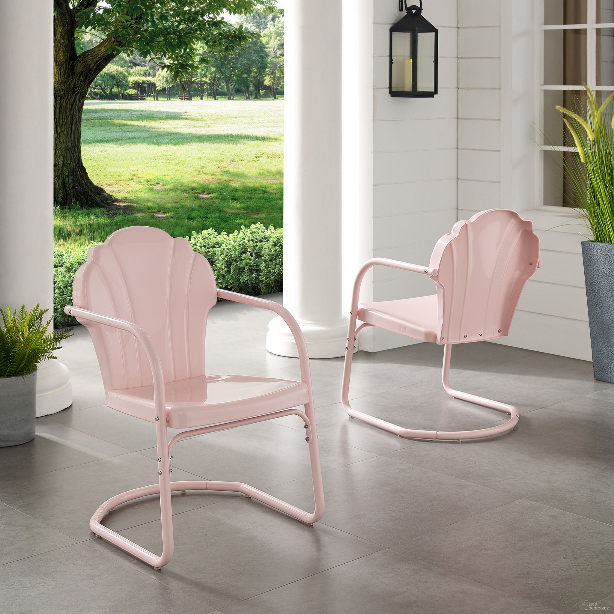 The appearance of Tulip Retro Outdoor Chair In Pastel Pink Gloss - Set of 2 designed by Crosley Brands in the transitional interior design. This pink piece of furniture  was selected by 1StopBedrooms from Tulip Collection to add a touch of cosiness and style into your home. Sku: CO1029-PI. Material: Steel.