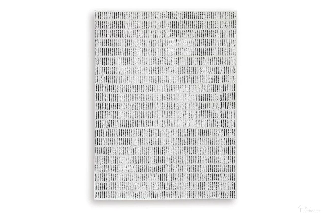 The appearance of Turinwith 5'3" x 7' Area Rug In Ivory and Black designed by Signature Design by Ashley in the modern / contemporary interior design. This ivory/black piece of furniture was selected by 1StopBedrooms from Turinwith Collection to add a touch of cosiness and style into your home. Sku: R407552. Material: Polyester.