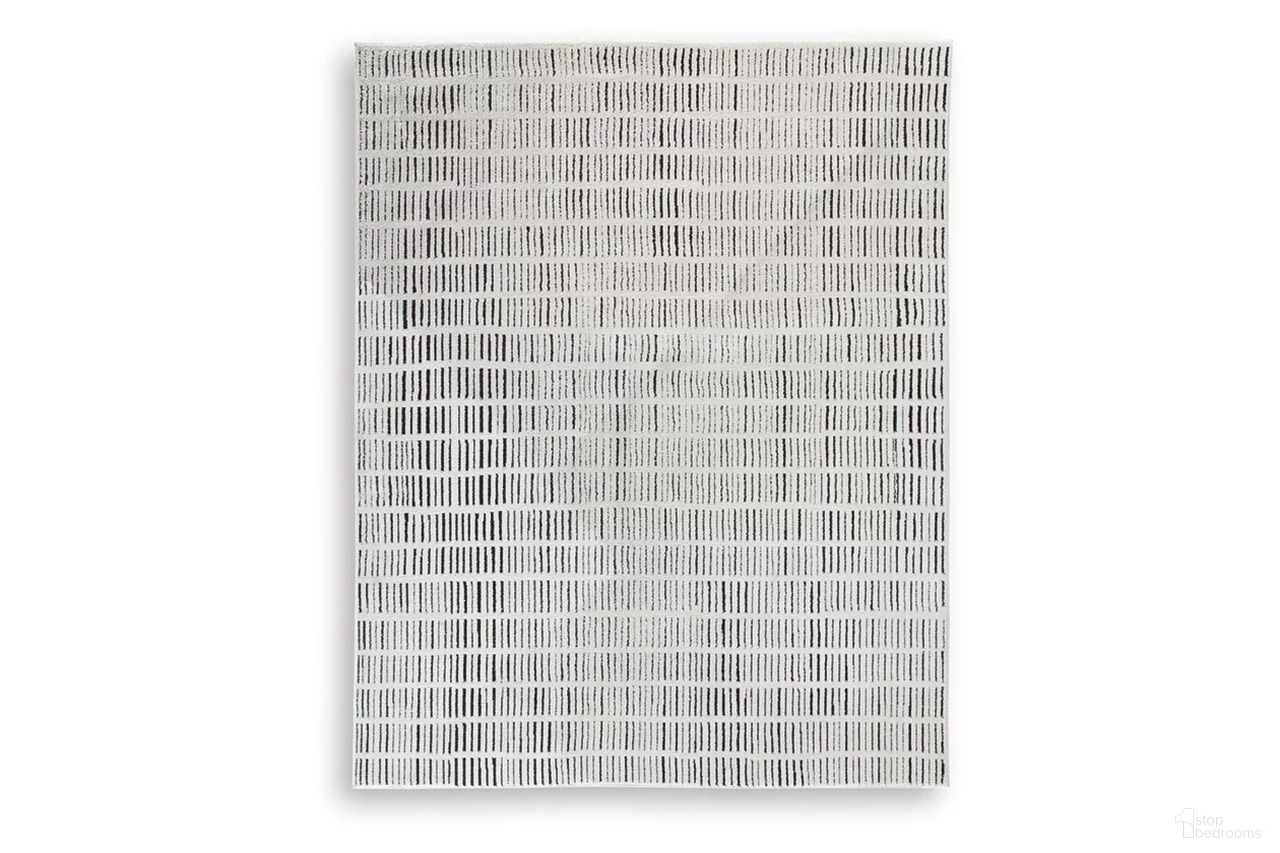 The appearance of Turinwith 7'10" x 9'10" Area Rug In Ivory and Black designed by Signature Design by Ashley in the modern / contemporary interior design. This ivory/black piece of furniture  was selected by 1StopBedrooms from Turinwith Collection to add a touch of cosiness and style into your home. Sku: R407551.
