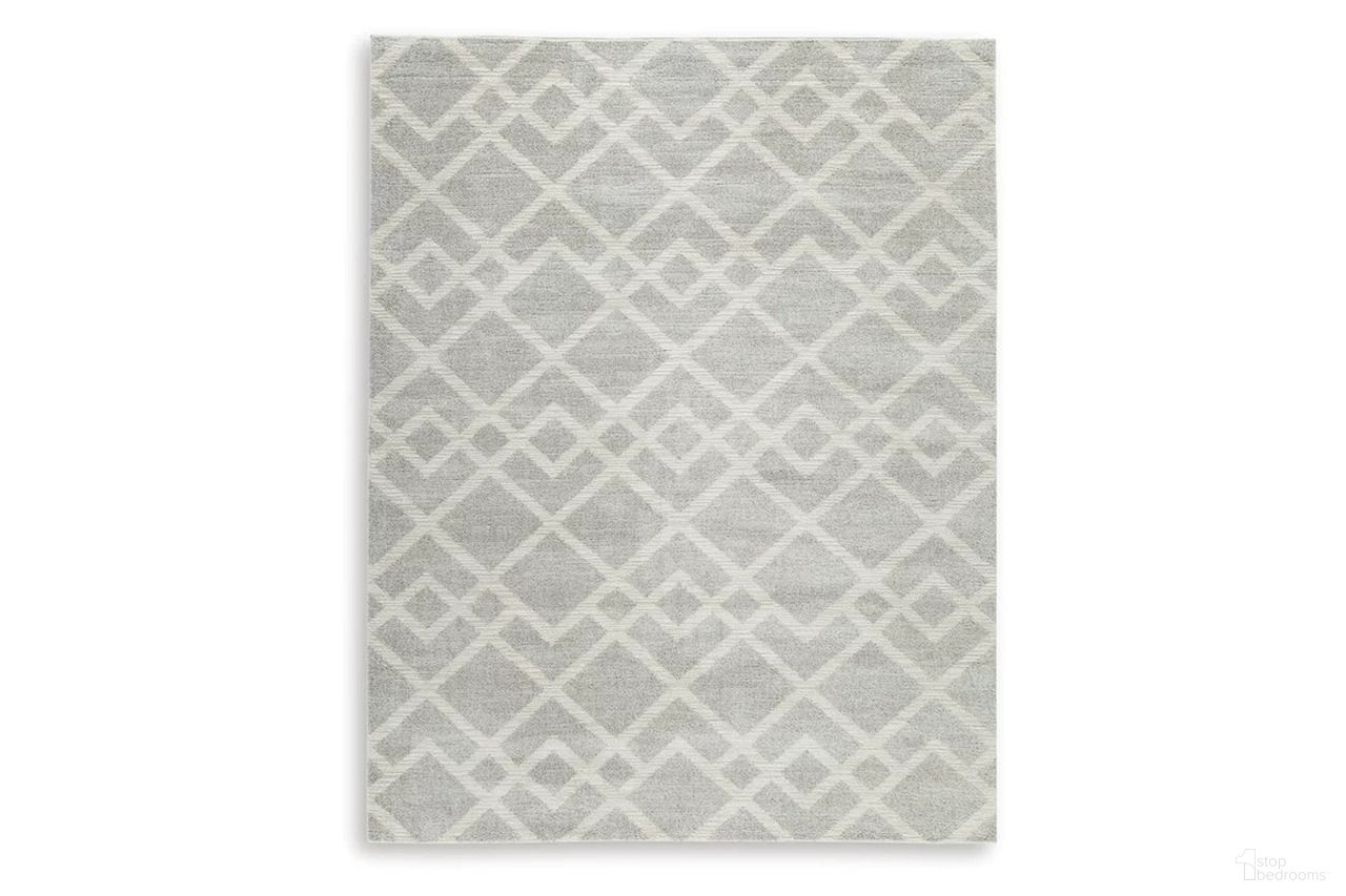 The appearance of Unawick Large Rug In Gray and Ivory designed by Signature Design by Ashley in the modern / contemporary interior design. This gray and ivory piece of furniture  was selected by 1StopBedrooms from Unawick Collection to add a touch of cosiness and style into your home. Sku: R407331. Material: Fabric.