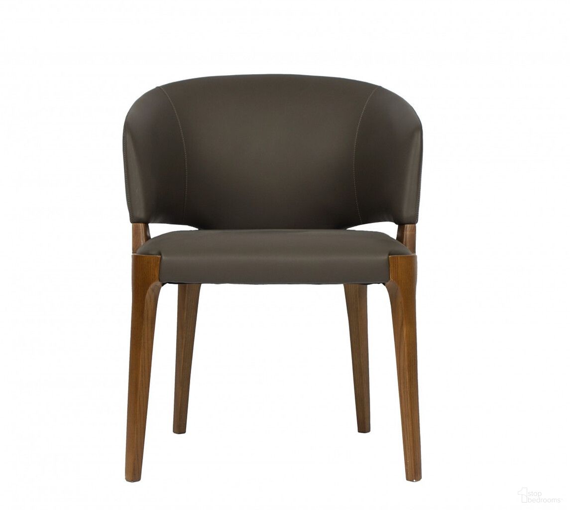 The appearance of Upholstered Faux Leather Wing Back Dining Arm Chair In Brown and Dark Gray designed by Homeroots in the transitional interior design. This brown and dark gray piece of furniture was selected by 1StopBedrooms from to add a touch of cosiness and style into your home. Sku: 488005. Material: Faux Leather. Chair Type: Arm Chair.