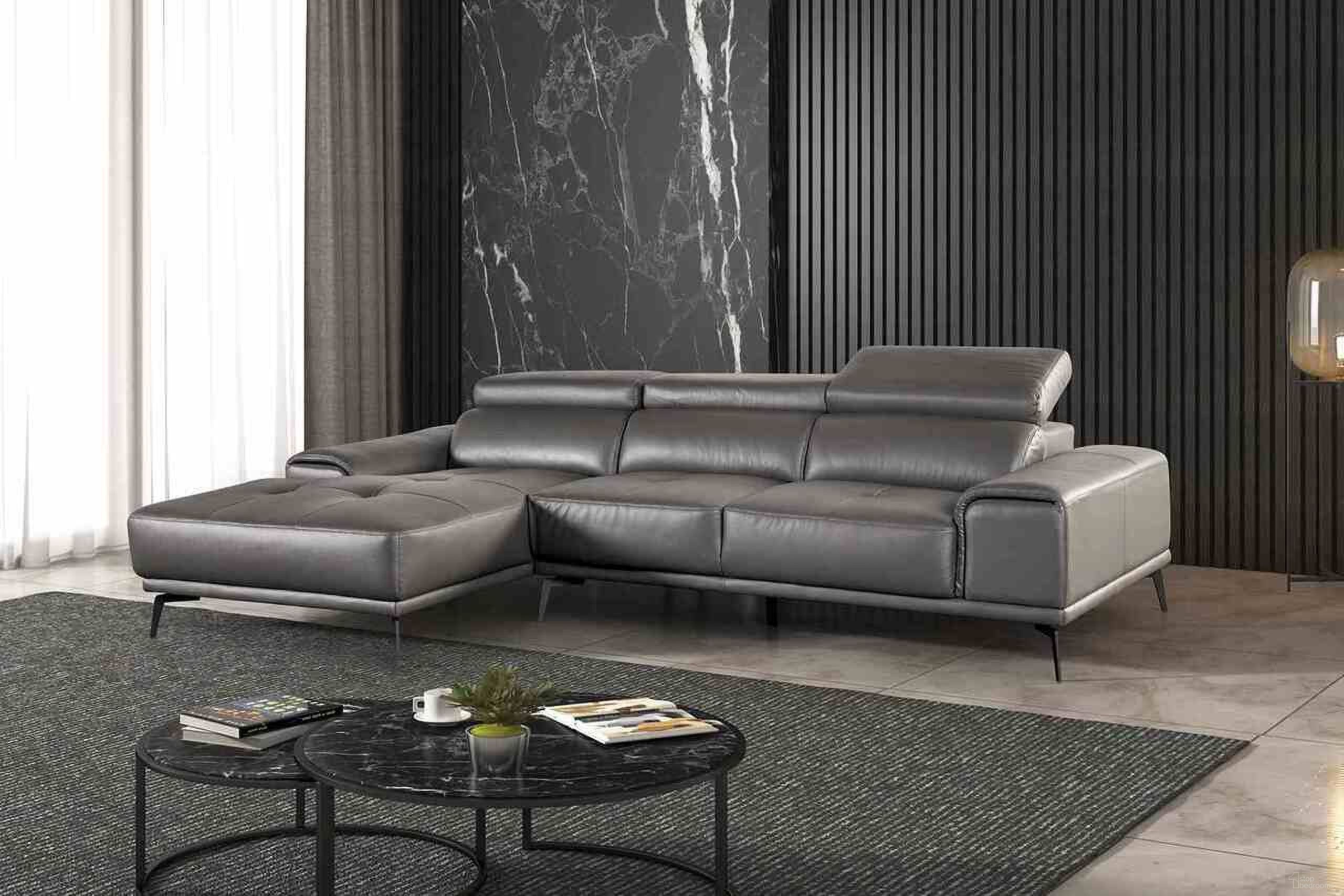 The appearance of Vadso Left Chaise Sectional In Dark Gray designed by Furniture of America in the modern / contemporary interior design. This dark gray piece of furniture was selected by 1StopBedrooms from Vadso Collection to add a touch of cosiness and style into your home. Sku: FM69005DG-LCE;FM69005DG-RLV. Material: Leather.