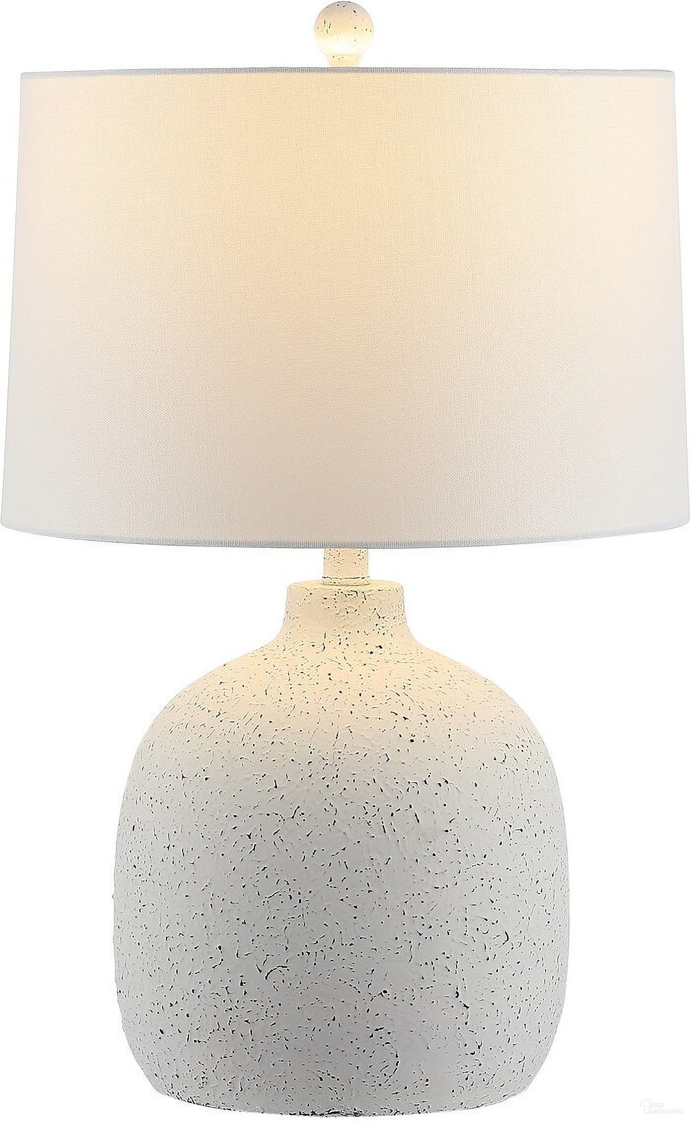 The appearance of Veleri Table Lamp in White designed by Safavieh in the coastal interior design. This white piece of furniture  was selected by 1StopBedrooms from Veleri Collection to add a touch of cosiness and style into your home. Sku: TBL4432A. Material: Resin.