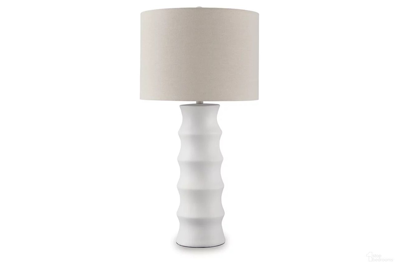 The appearance of Veraleigh Table Lamp In White designed by Signature Design by Ashley in the modern / contemporary interior design. This white piece of furniture  was selected by 1StopBedrooms from Veraleigh Collection to add a touch of cosiness and style into your home. Sku: L235854.