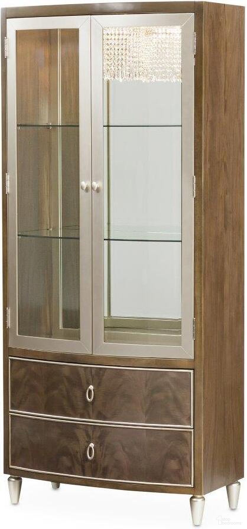 The appearance of Villa Cherie Display Cabinet In Hazelnut designed by Michael Amini in the transitional interior design. This hazelnut piece of furniture was selected by 1StopBedrooms from Villa Collection to add a touch of cosiness and style into your home. Sku: N9008209-410. Material: Glass.