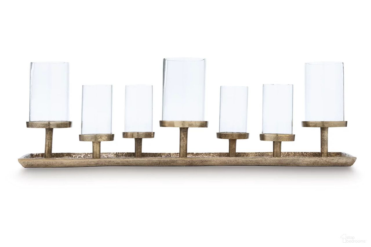 The appearance of Wallmond Candle Holder In Antique Brass designed by Signature Design by Ashley in the transitional interior design. This antique brass piece of furniture was selected by 1StopBedrooms from Wallmond Collection to add a touch of cosiness and style into your home. Sku: A2000820.