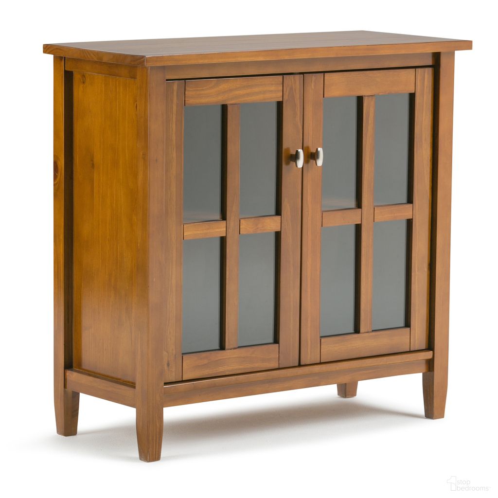 The appearance of Warm Shaker Solid Wood Low Storage Cabinet In Light Golden Brown designed by Simpli Home in the transitional interior design. This light golden brown piece of furniture  was selected by 1StopBedrooms from Warm Shaker Collection to add a touch of cosiness and style into your home. Sku: AXCRWSH14-LGB. Material: Pine.