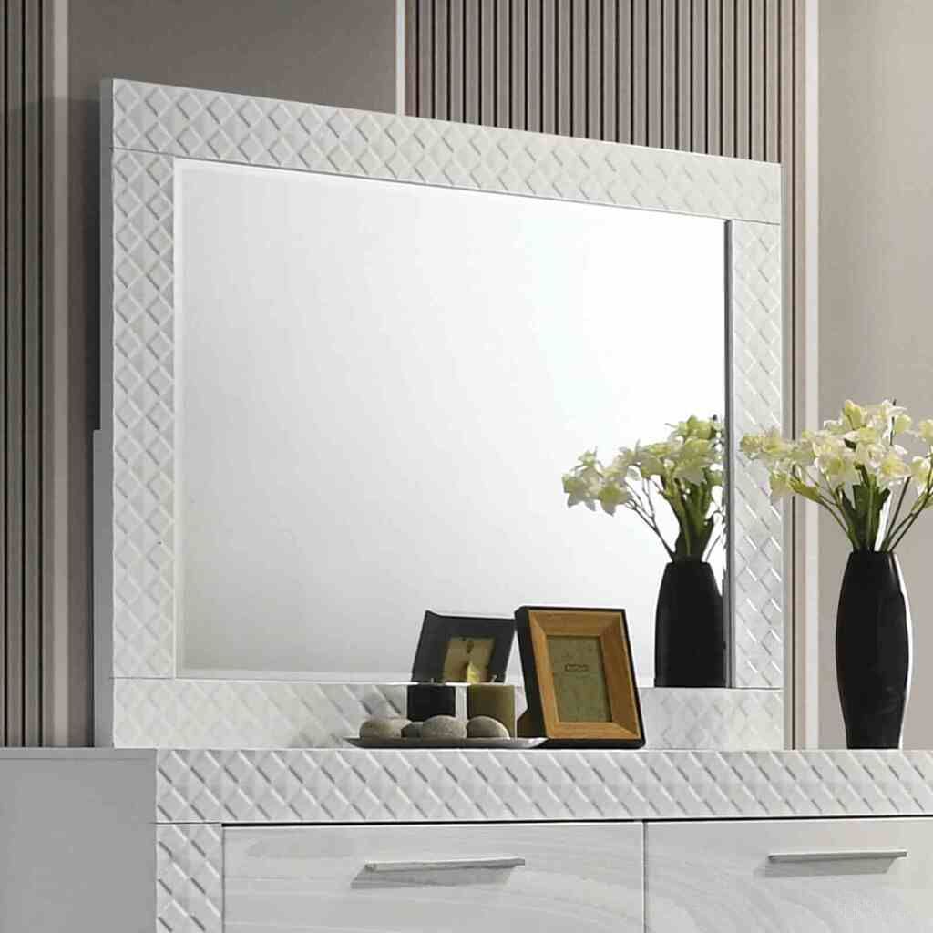 The appearance of Whitby Mirror In White designed by Furniture of America in the glam interior design. This white piece of furniture  was selected by 1StopBedrooms from Whitby Collection to add a touch of cosiness and style into your home. Sku: FM7216WH-M. Material: Engineered Wood.