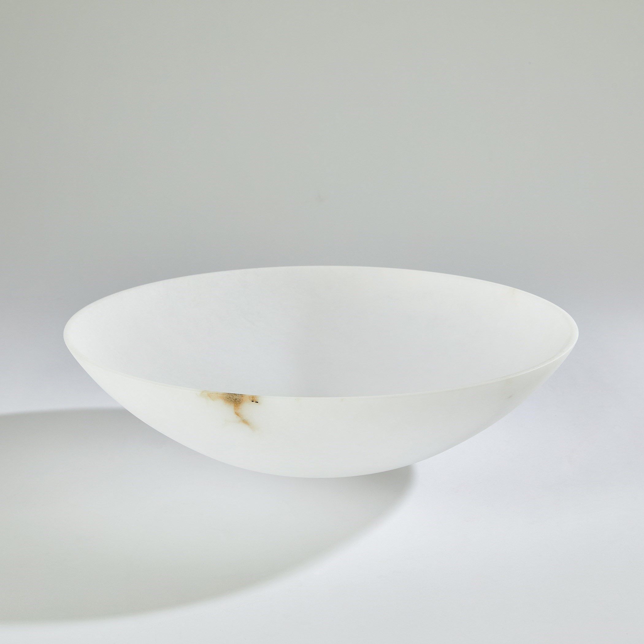 The appearance of Wide Alabaster Bowl In White designed by Global Views in the modern / contemporary interior design. This white piece of furniture was selected by 1StopBedrooms from Wide Collection to add a touch of cosiness and style into your home. Sku: 331748. Material: Alabaster.