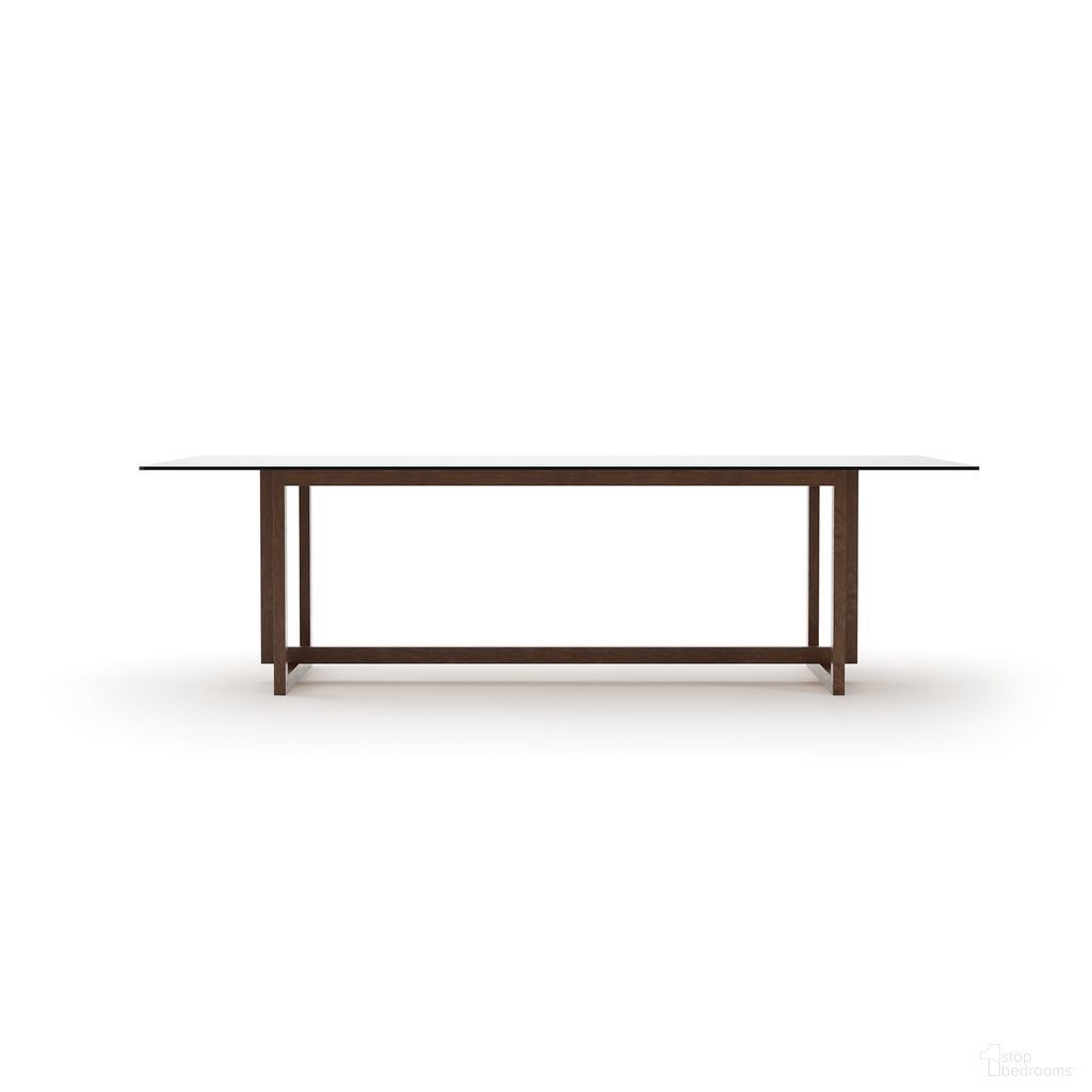 The appearance of Wish You Were Here 104 Inch Rectangular Dining Table In Brown designed by Caracole in the modern / contemporary interior design. This brown piece of furniture was selected by 1StopBedrooms from Wish You Were Here Collection to add a touch of cosiness and style into your home. Sku: CLA-425V-2020B;GLA-10444V-001T. Table Base Style: Trestle. Material: Glass. Table Top Shape: Rectangular. Size: 44" x 104".