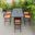 Chelsea Aluminum Outdoor Dining Set with 1 Bar Height Fire Pit Table and 6 Bar Chair In Black with Orange Cushions
