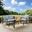 Kaplan 3 Piece Outdoor Loveseat Patio Furniture Set In Mist and Oil Rubbed Bronze
