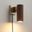 Tambo Plug-in Wall Sconce In Dark Walnut and Weathered Brass