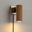 Tambo Plug-in Wall Sconce In Natural Ash and Weathered Brass